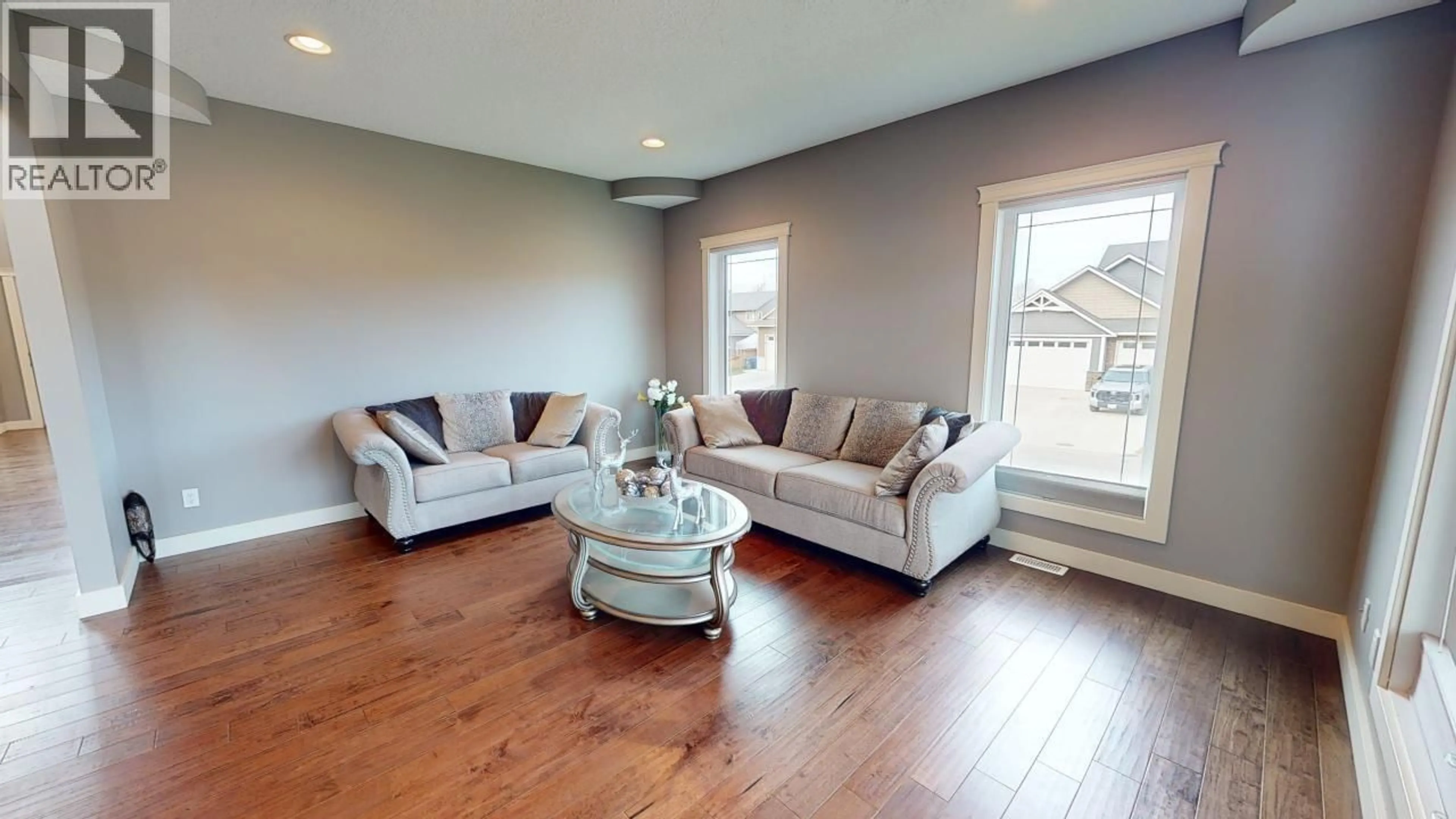 Living room with furniture, wood/laminate floor for 10712 109 STREET, Fort St. John British Columbia V1J0J3