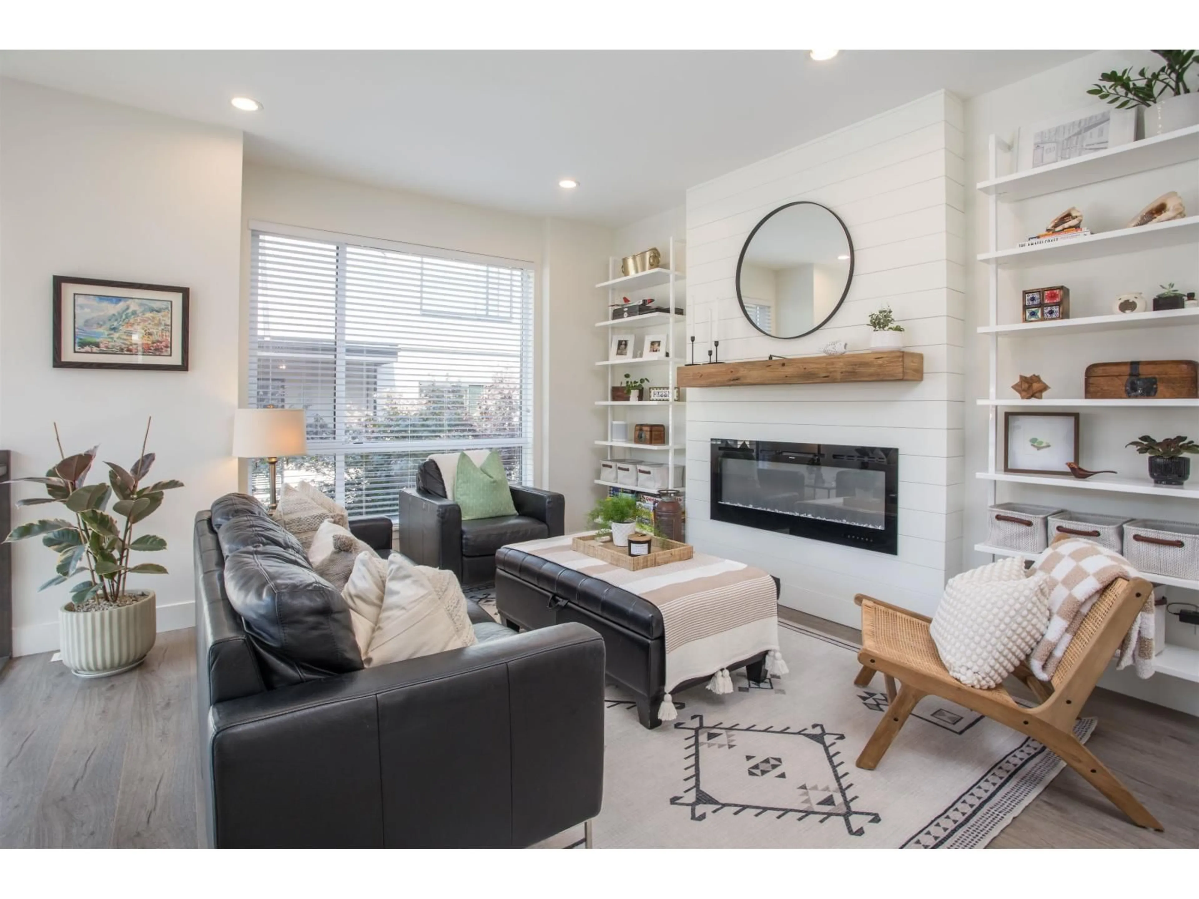 Living room with furniture, wood/laminate floor for 28 - 15688 28, Surrey British Columbia V3Z0N1