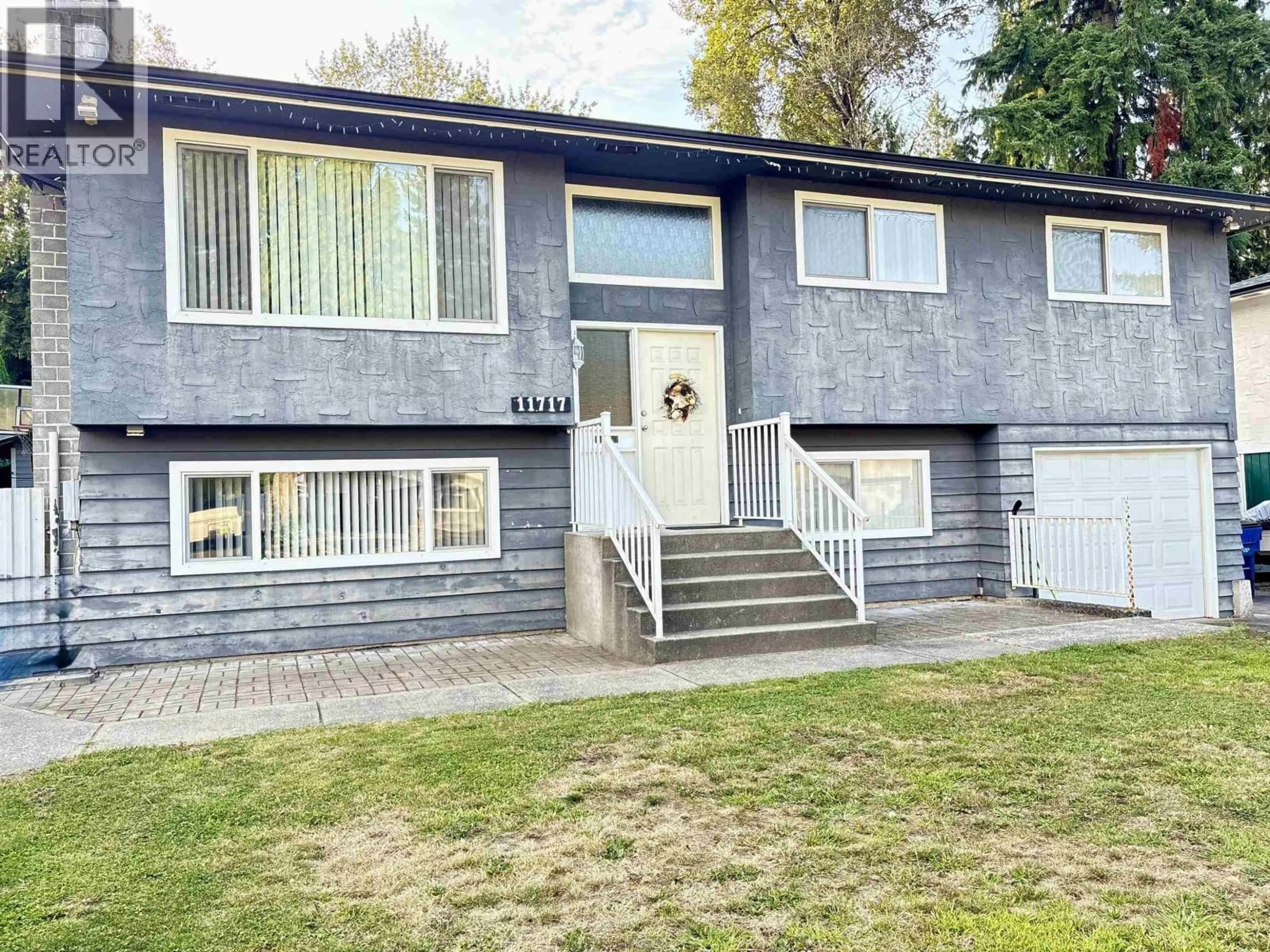 Home with vinyl exterior material, street for 11717 209TH STREET, Maple Ridge British Columbia V2X7S6