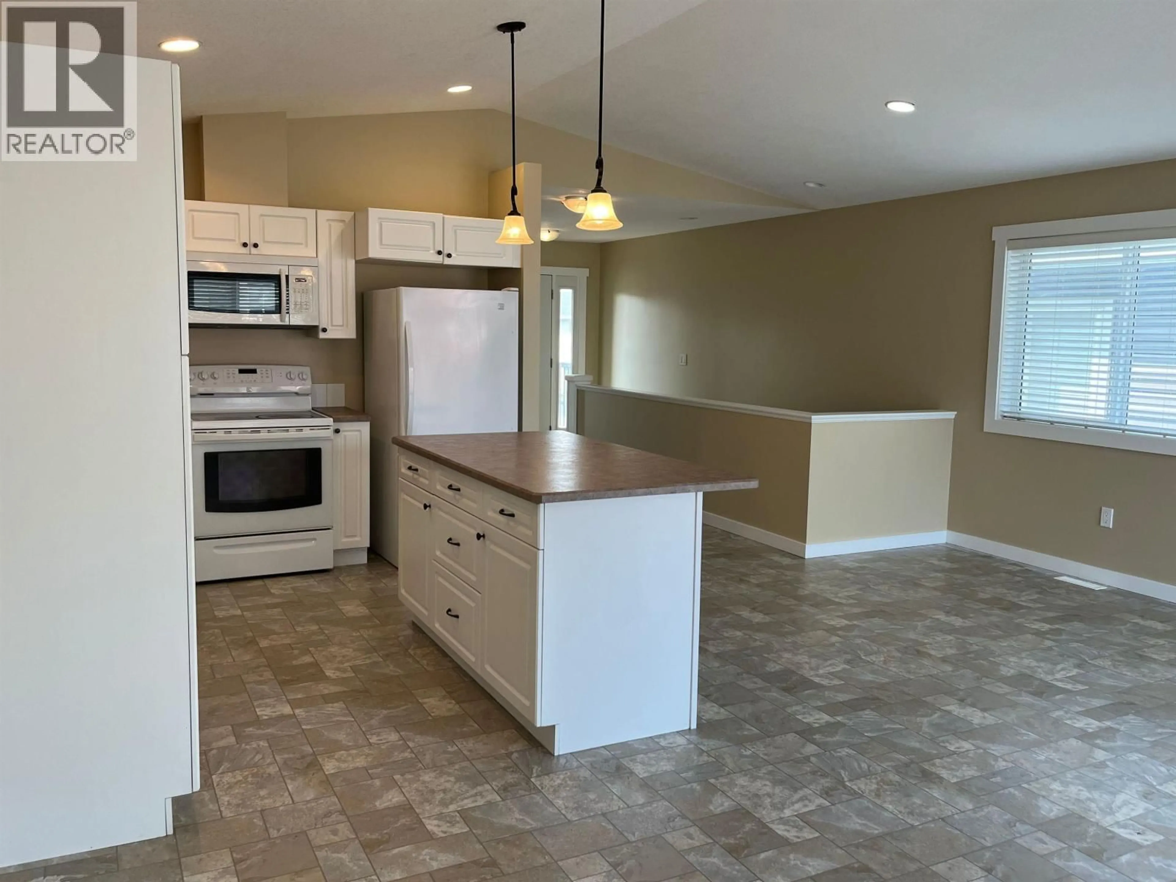 Open concept kitchen, ceramic/tile floor for 8334 87 AVENUE, Fort St. John British Columbia V1J0K8