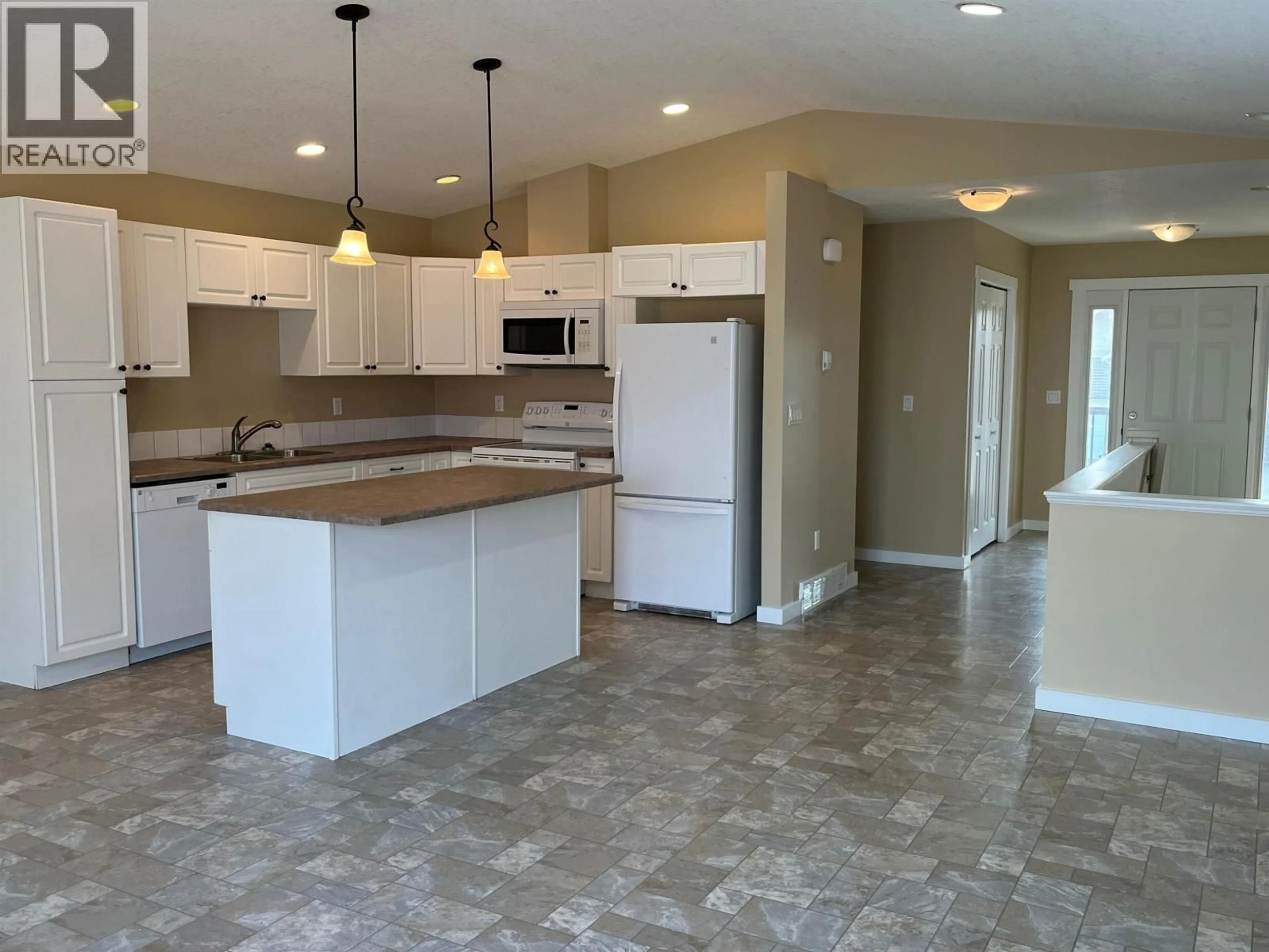 Open concept kitchen, ceramic/tile floor for 8334 87 AVENUE, Fort St. John British Columbia V1J0K8