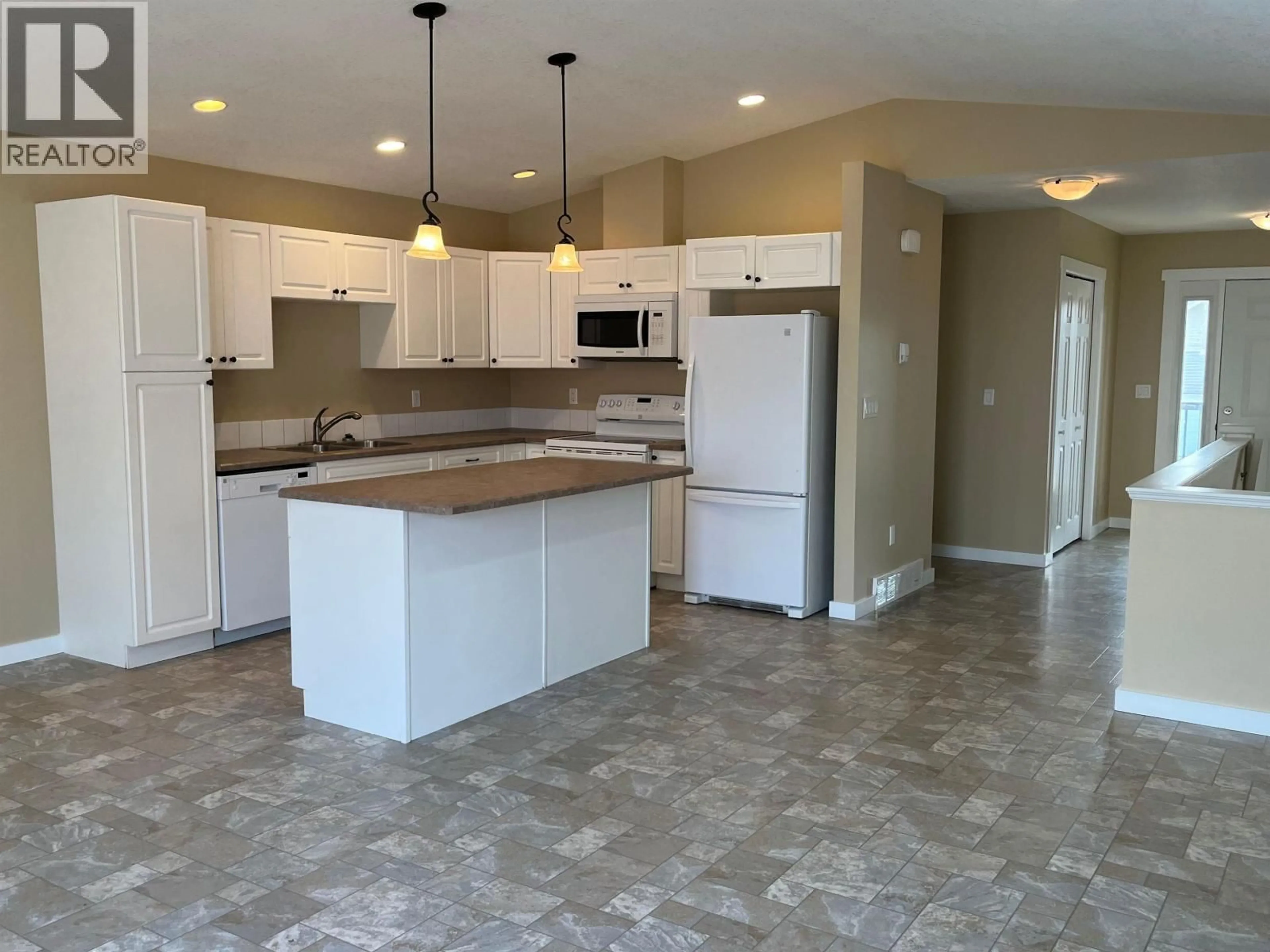 Open concept kitchen, ceramic/tile floor for 8334 87 AVENUE, Fort St. John British Columbia V1J0K8