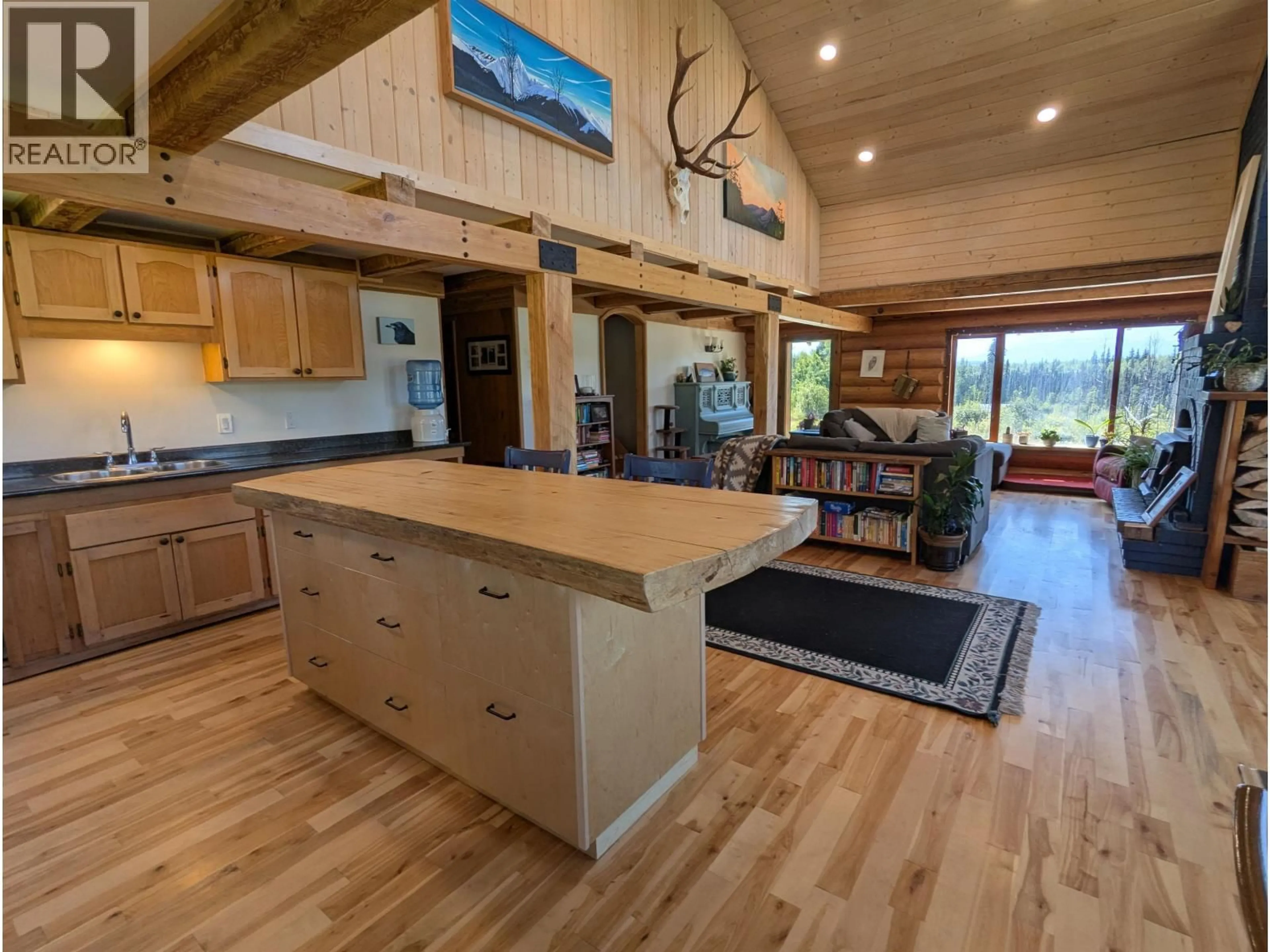 Open concept kitchen, wood/laminate floor for 69 MULDOON ROAD, Hazelton British Columbia V0J1Y5