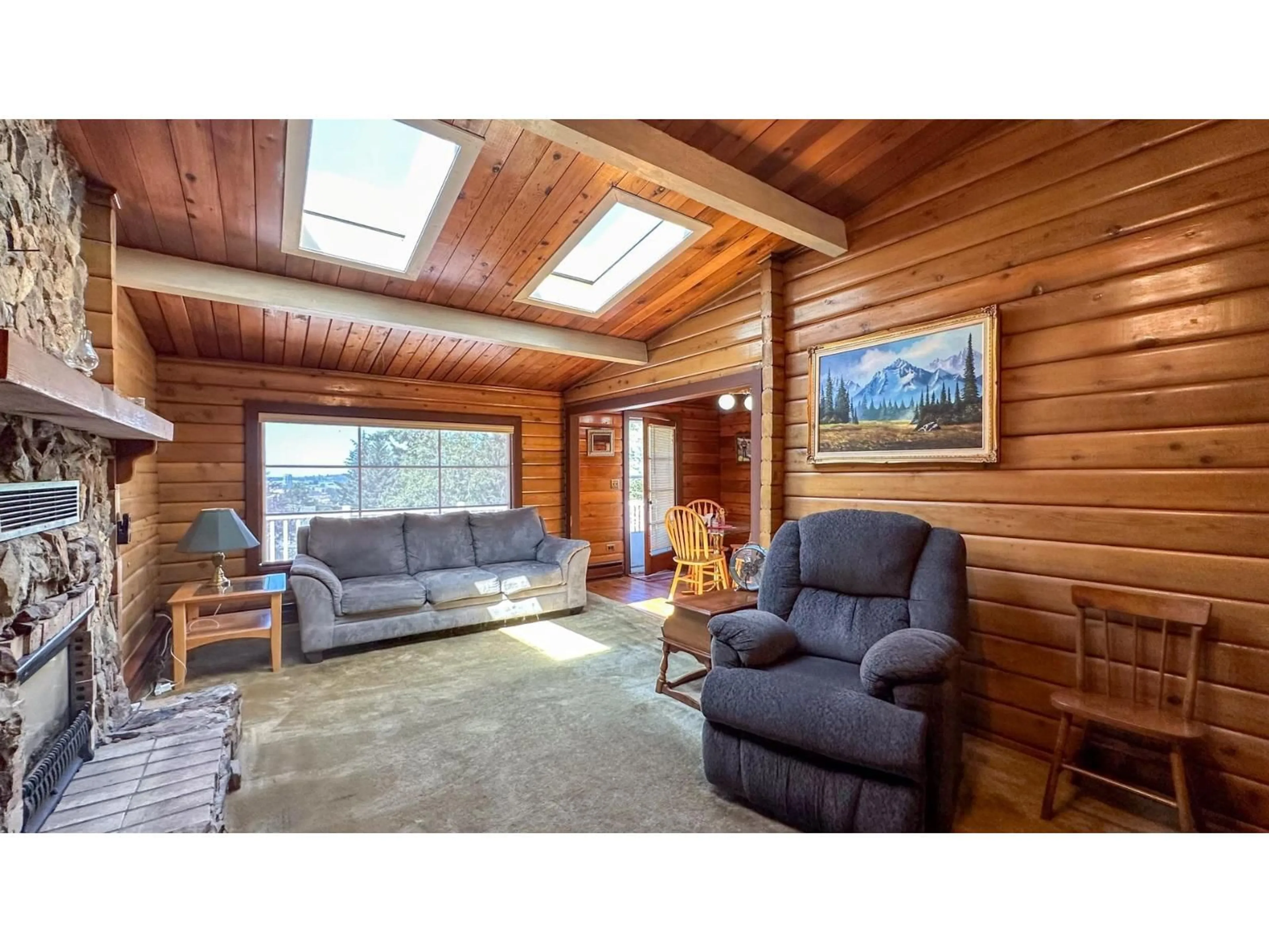 Living room with furniture, wood/laminate floor for 10542 125B, Surrey British Columbia V3V5A7