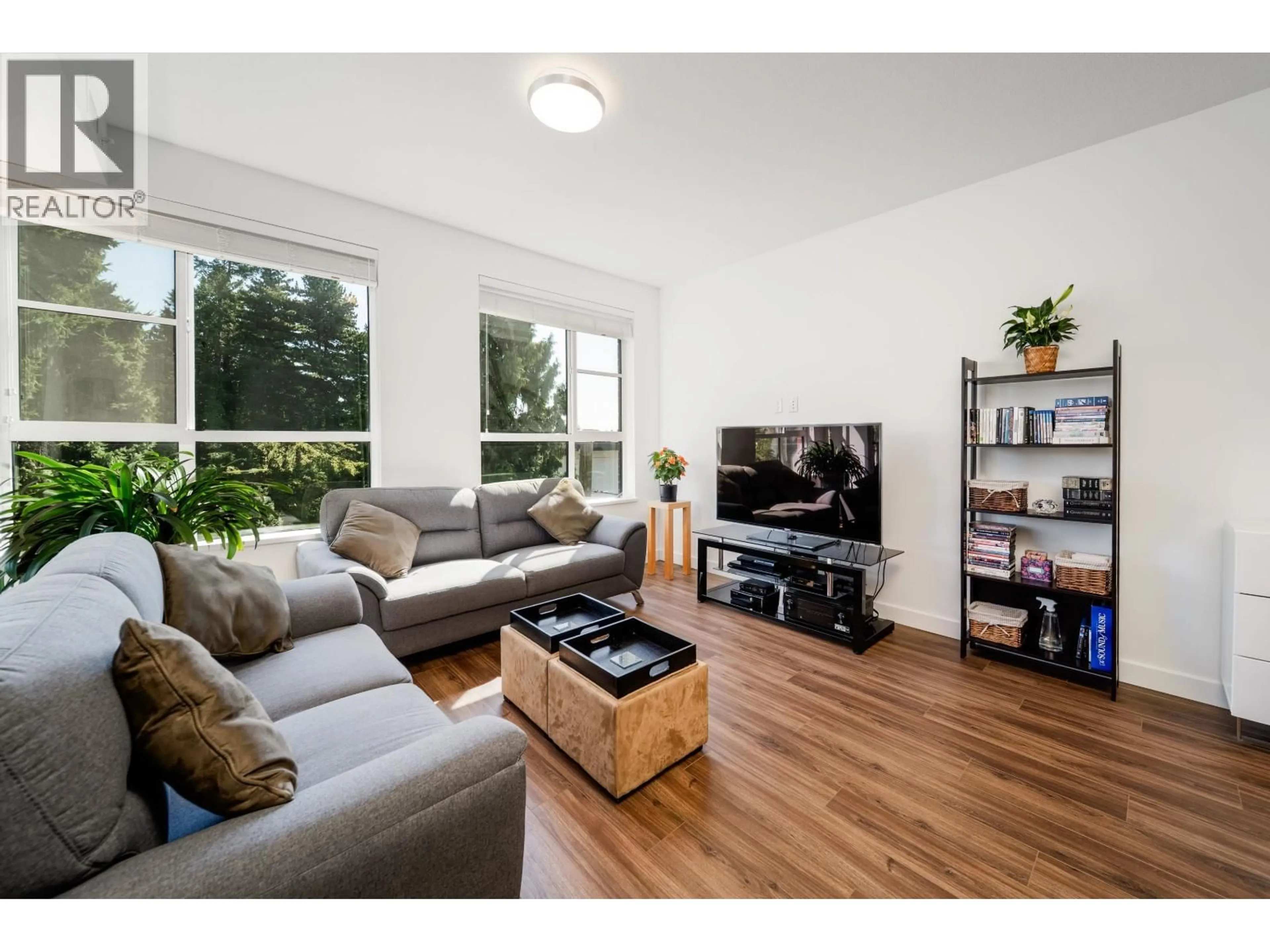 Living room with furniture, wood/laminate floor for 311 - 7928 YUKON STREET, Vancouver British Columbia V5X2Y7