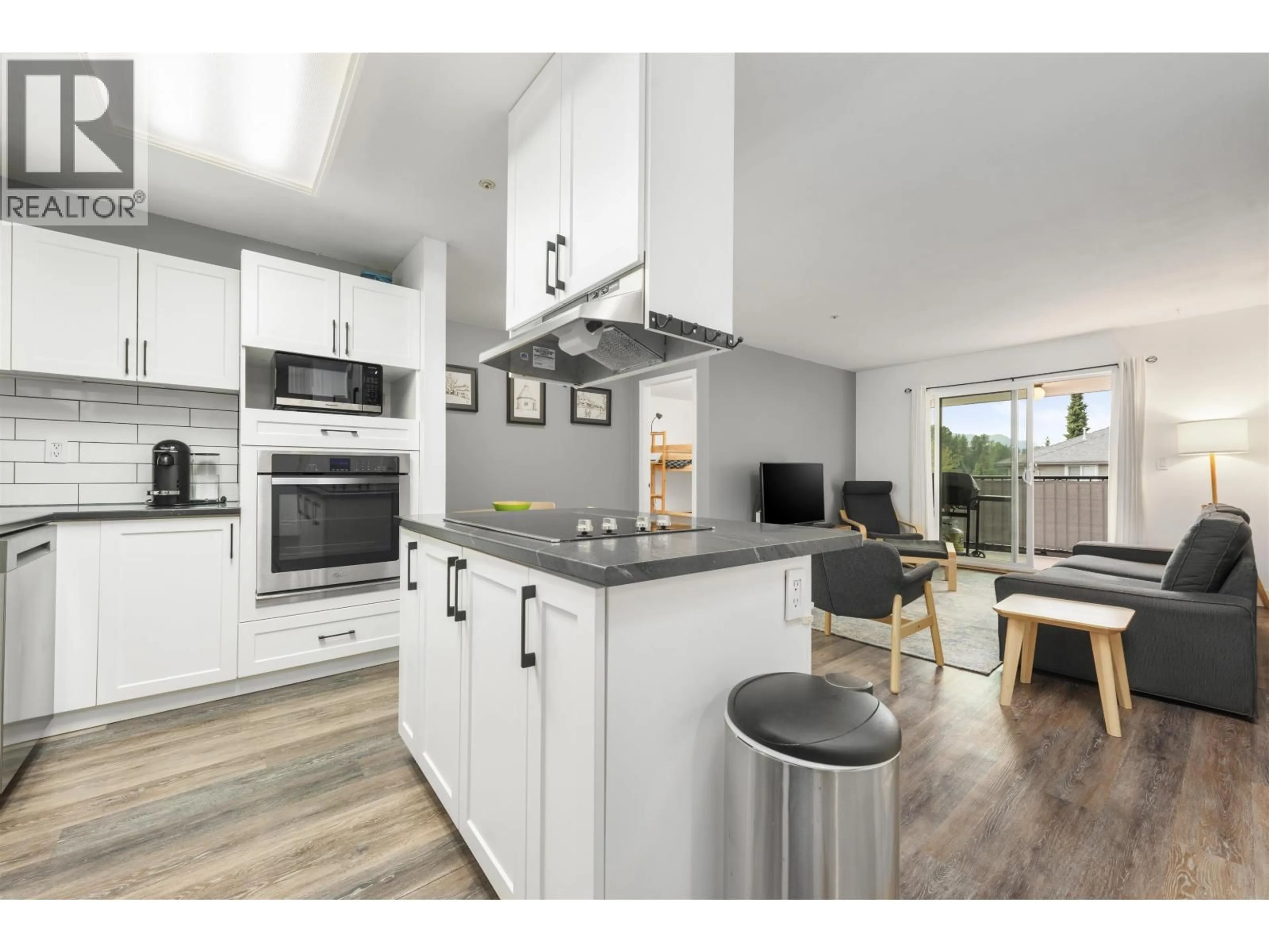 Open concept kitchen, wood/laminate floor for D202 - 40160 WILLOW CRESCENT, Squamish British Columbia V8B0M2