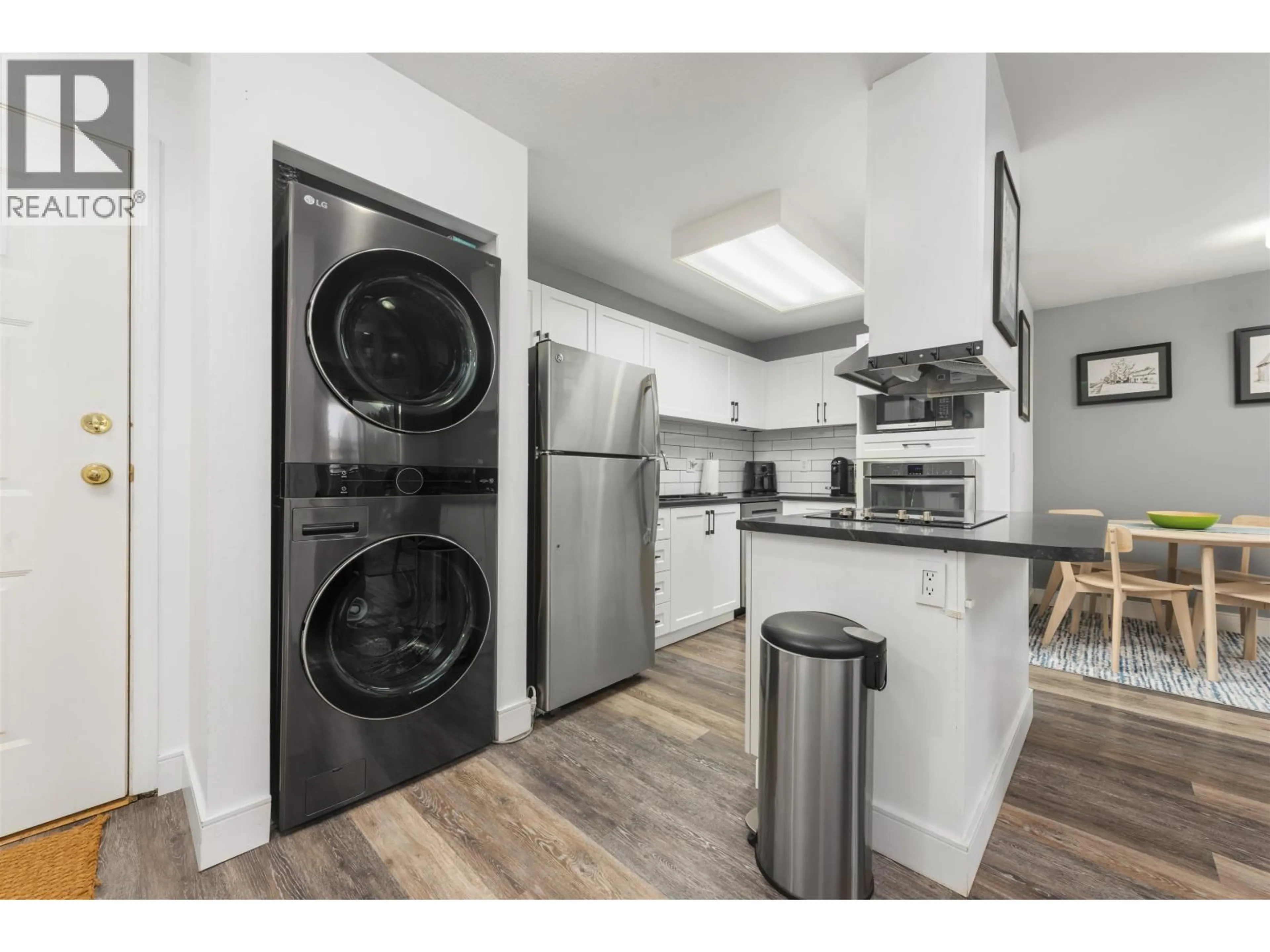 Kitchen with laundary machines, wood/laminate floor for D202 - 40160 WILLOW CRESCENT, Squamish British Columbia V8B0M2