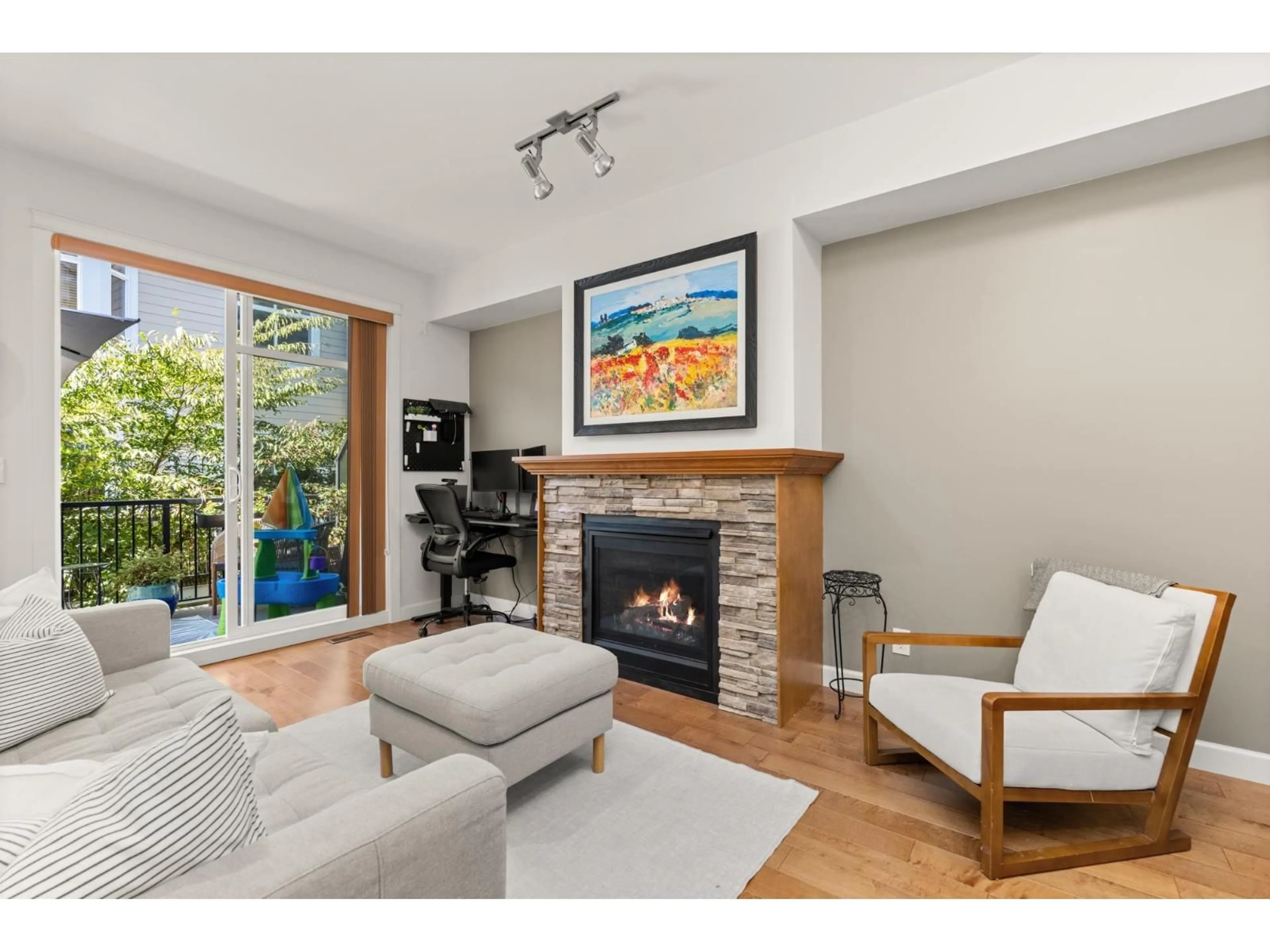 Living room with furniture, wood/laminate floor for 93 - 8068 207, Langley British Columbia V2Y0M9