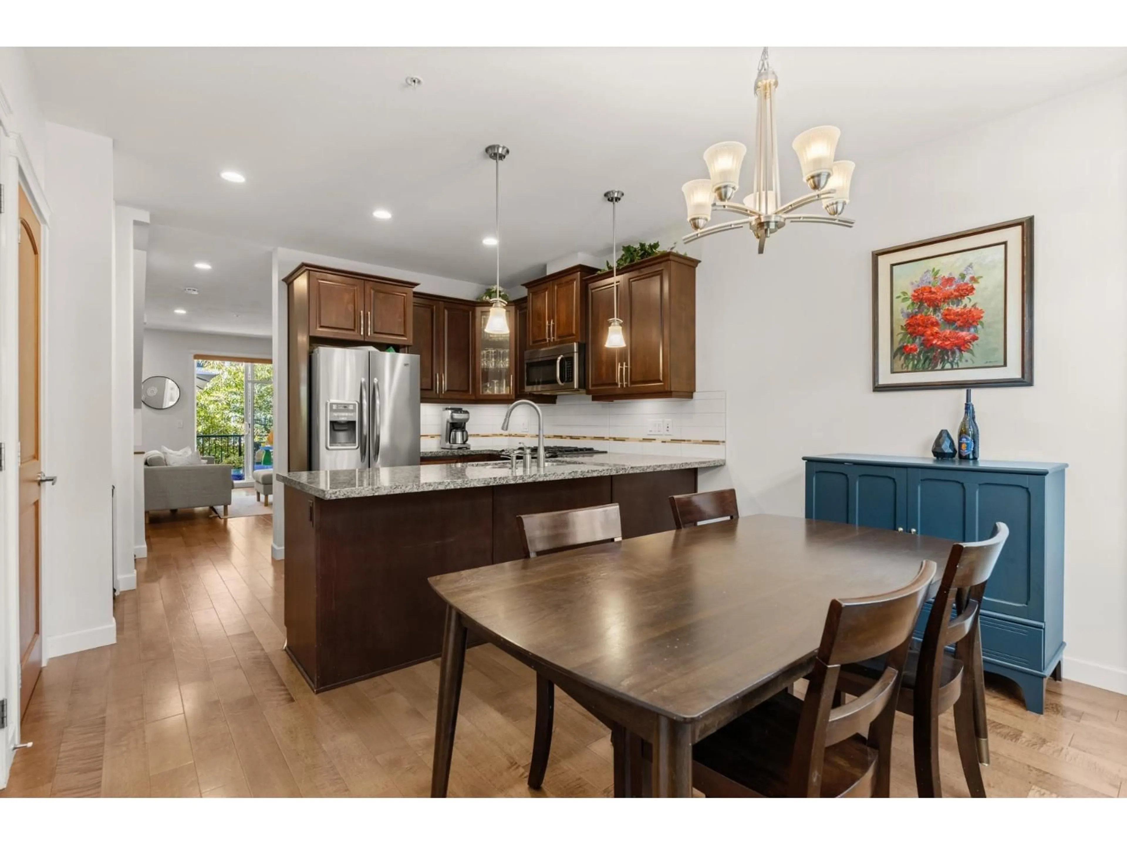 Open concept kitchen, wood/laminate floor for 93 - 8068 207, Langley British Columbia V2Y0M9