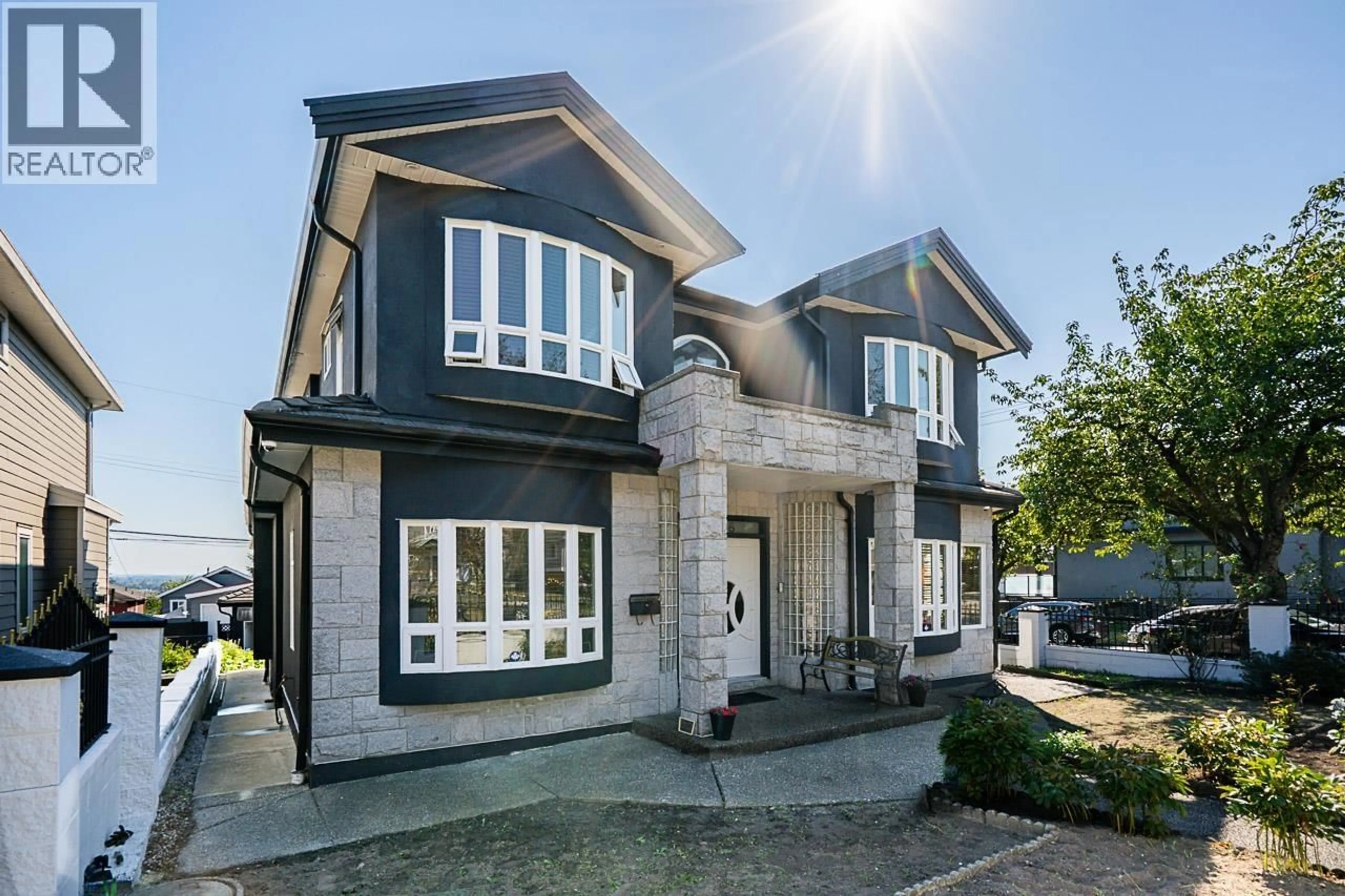 Home with brick exterior material, street for 1306 60 AVENUE, Vancouver British Columbia V5X2A9