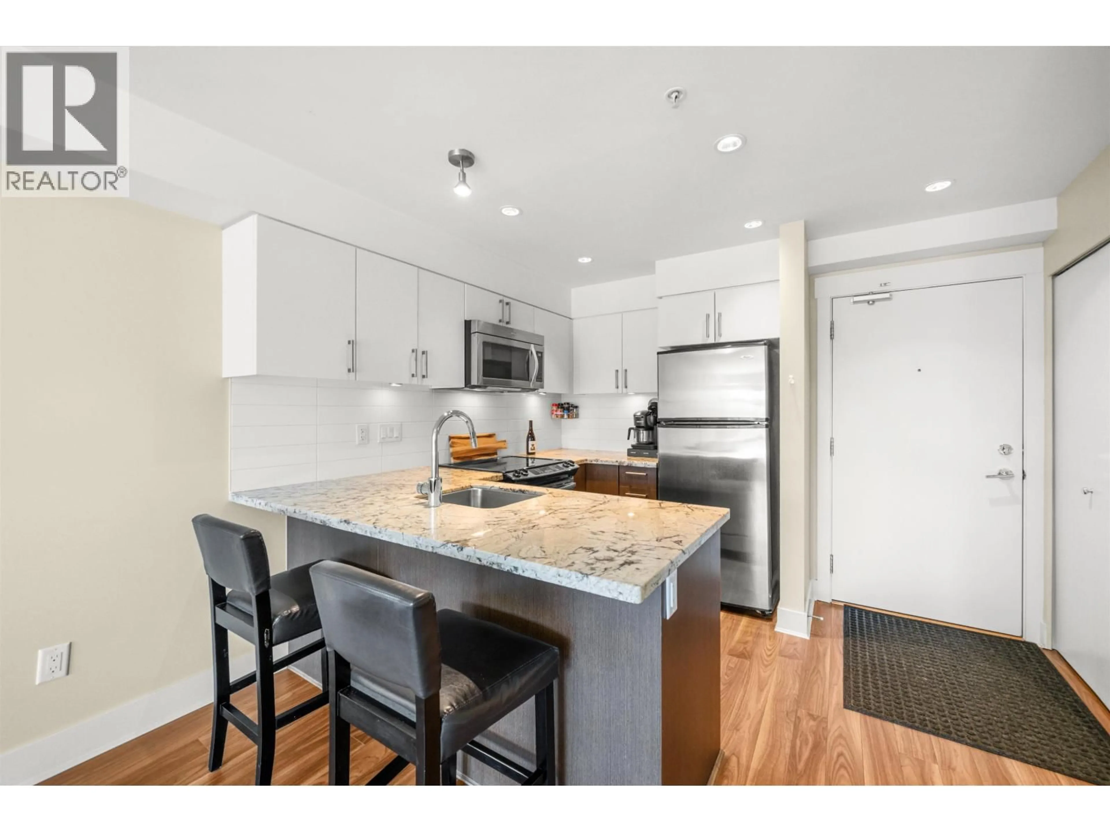 Open concept kitchen, wood/laminate floor for 319 - 85 EIGHTH AVENUE, New Westminster British Columbia V3L0E9