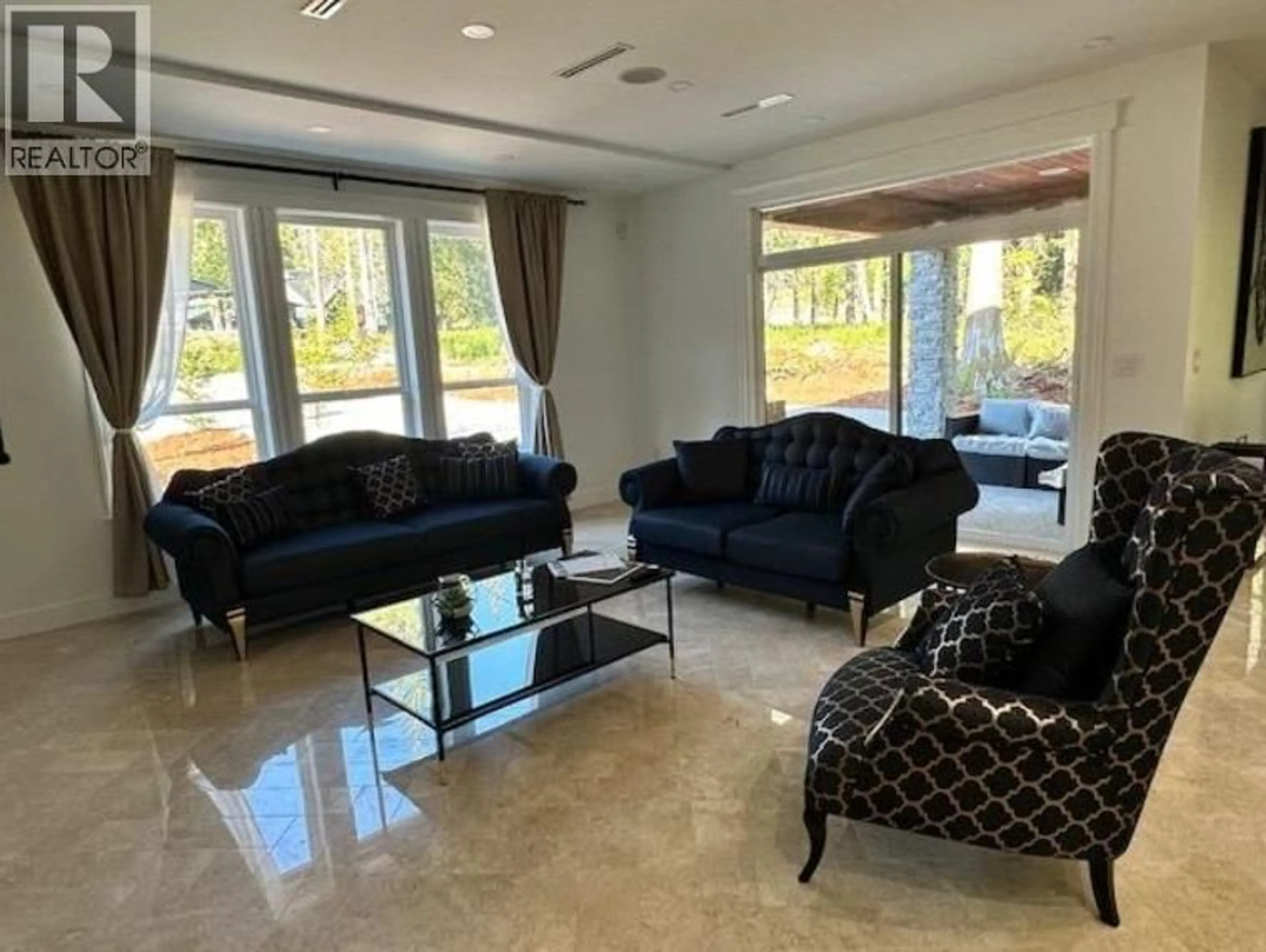 Living room with furniture, ceramic/tile floor for 1102 LARGO ROAD, Roberts Creek British Columbia V0N2W2