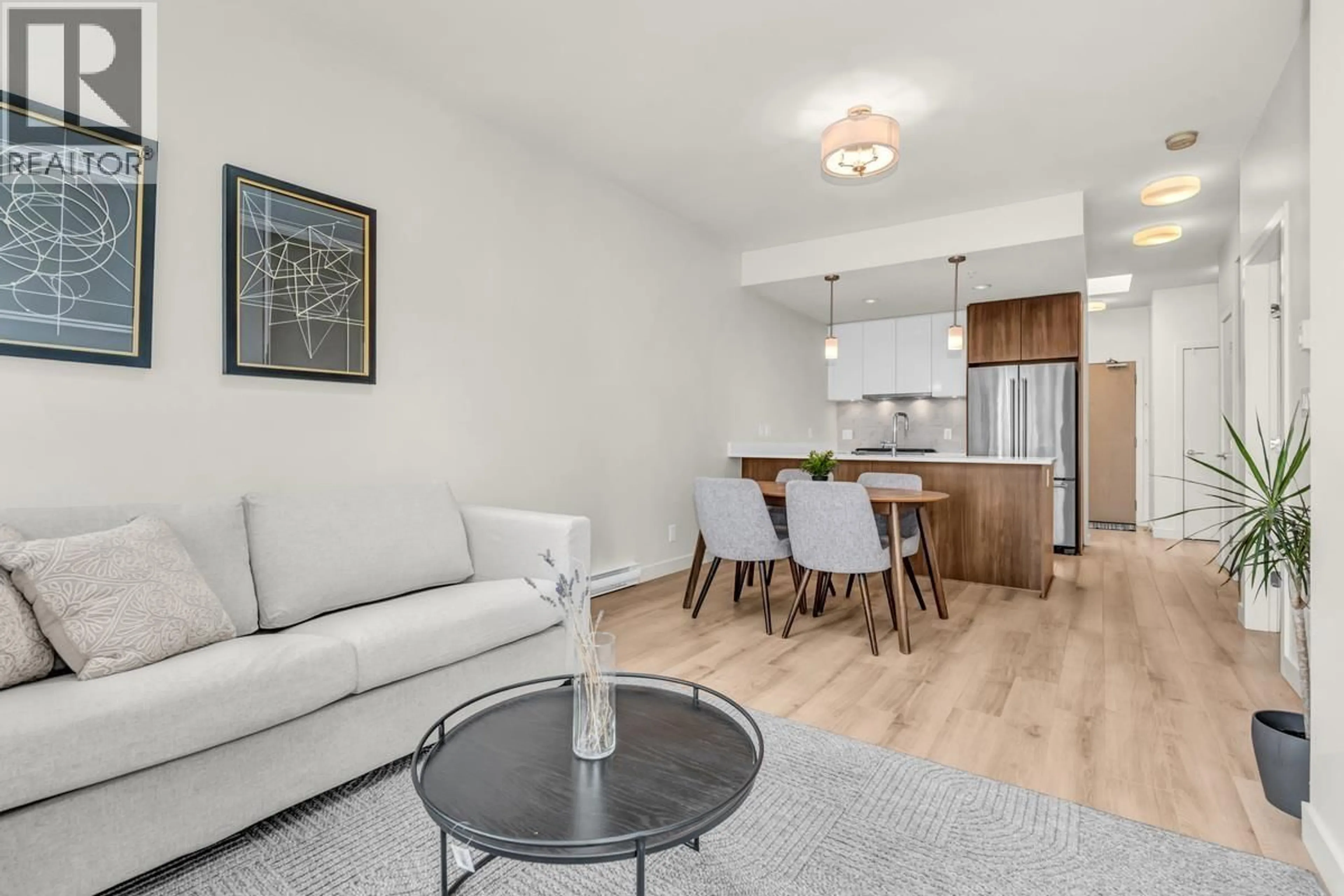 Living room with furniture, wood/laminate floor for 603 - 2188 MADISON AVENUE, Burnaby British Columbia V5C0J8