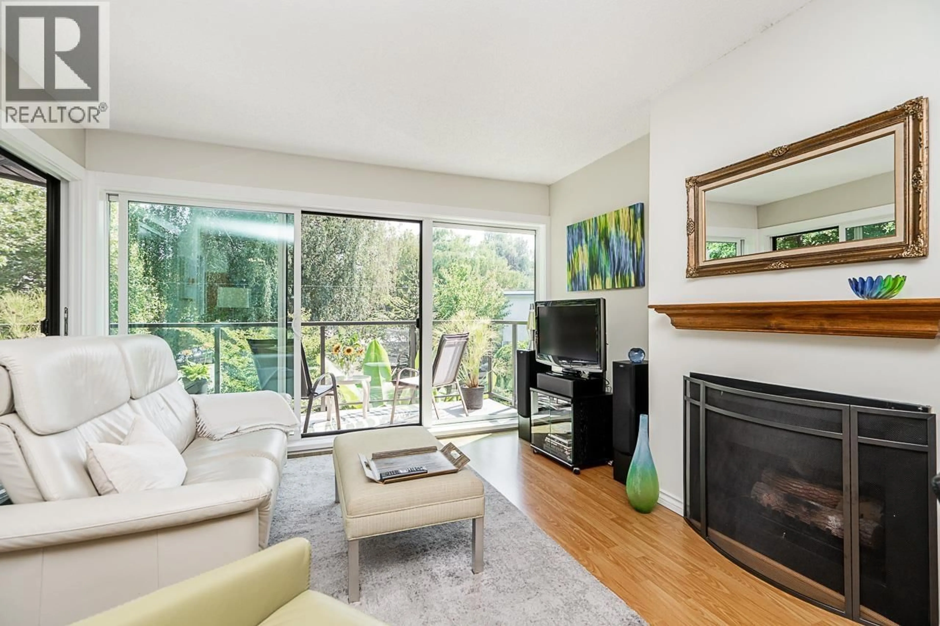Living room with furniture, wood/laminate floor for 406 - 2366 WALL STREET, Vancouver British Columbia V5L4Y1