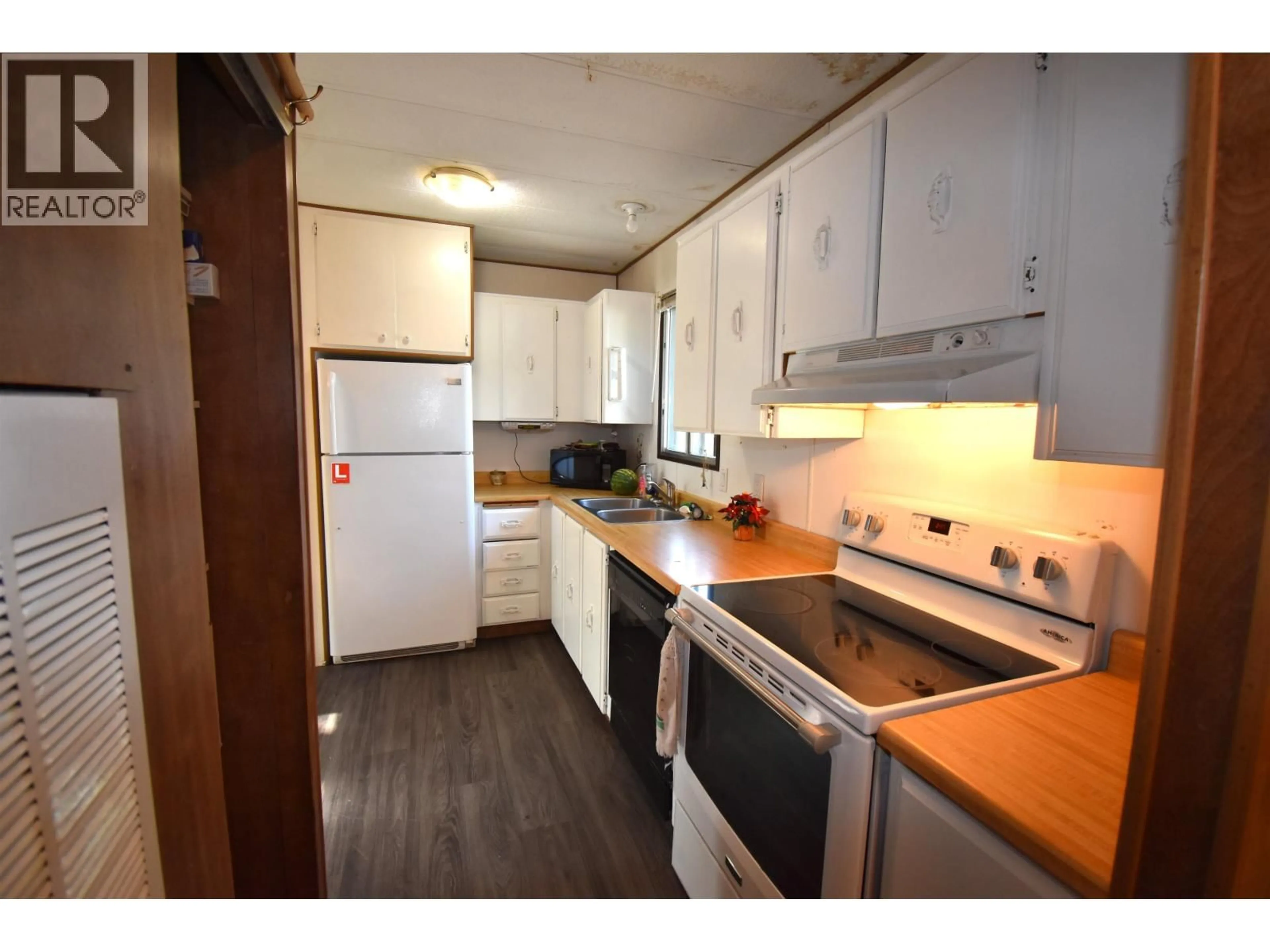Standard kitchen, wood/laminate floor for 101 - 4430 16 HIGHWAY, Smithers British Columbia V0J2N0