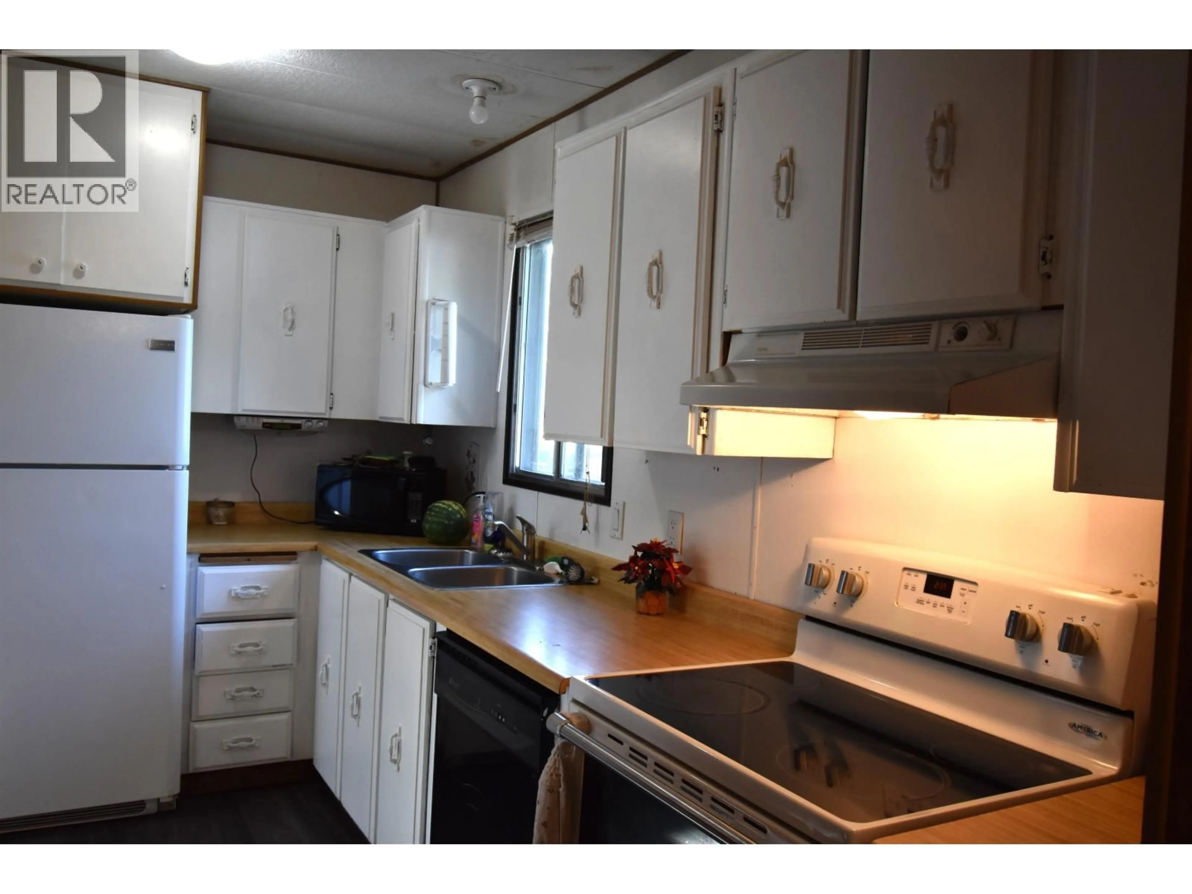 Standard kitchen, wood/laminate floor for 101 - 4430 16 HIGHWAY, Smithers British Columbia V0J2N0