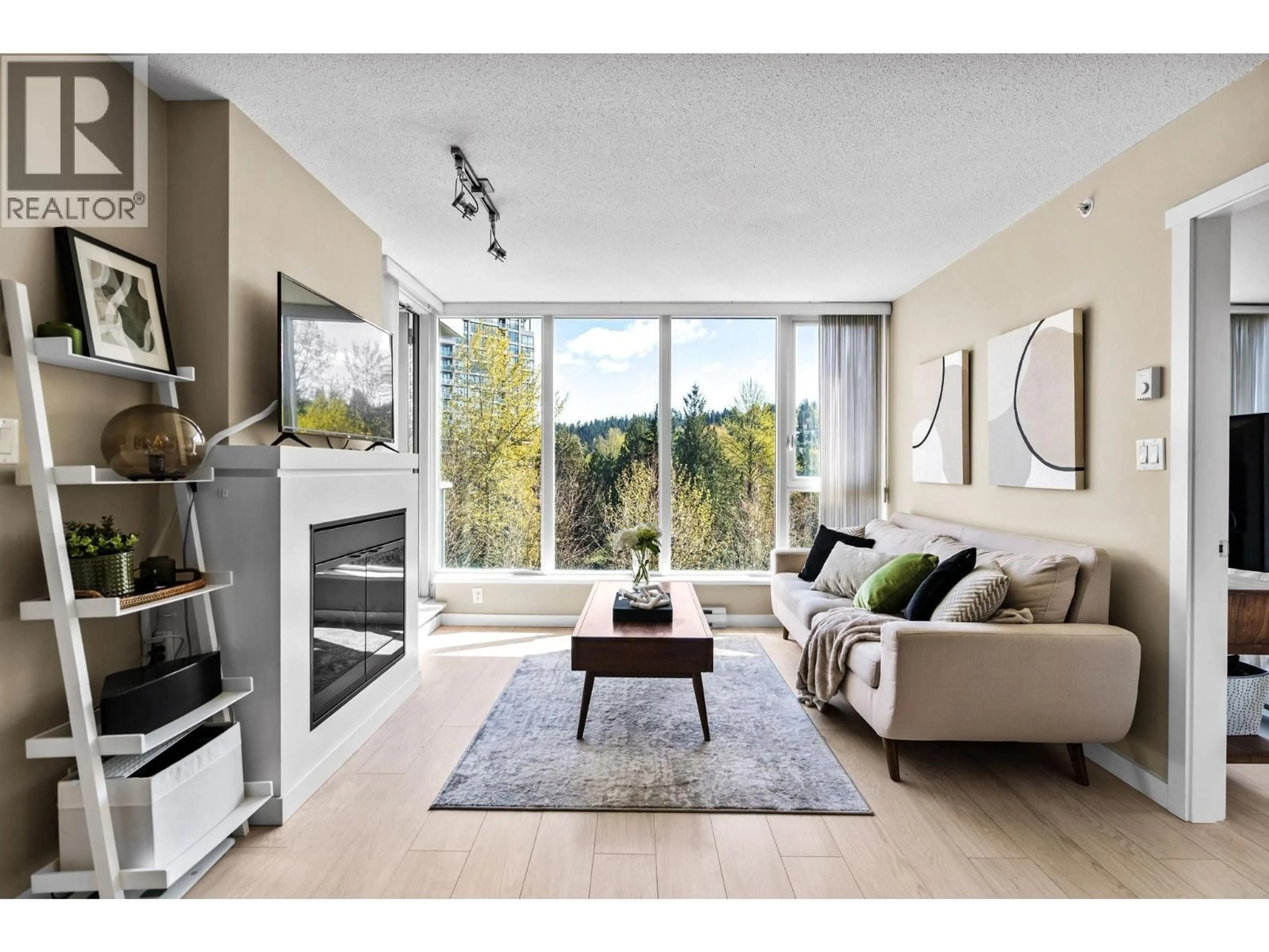 Living room with furniture, wood/laminate floor for 1009 - 660 NOOTKA WAY, Port Moody British Columbia V3H0B7