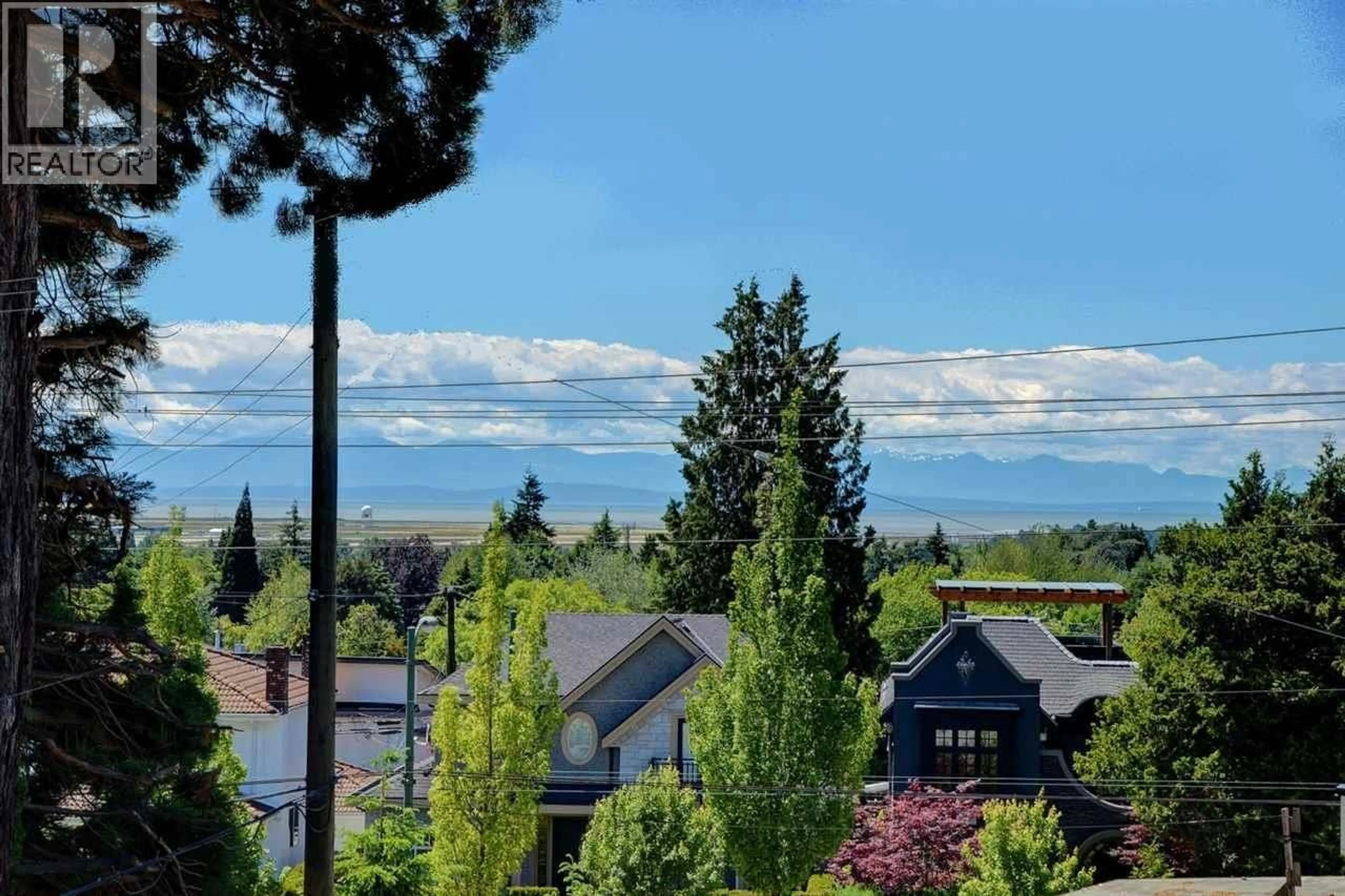 A pic from outside/outdoor area/front of a property/back of a property/a pic from drone, mountain view for 304 - 1880 57TH AVENUE, Vancouver British Columbia V6P1T7