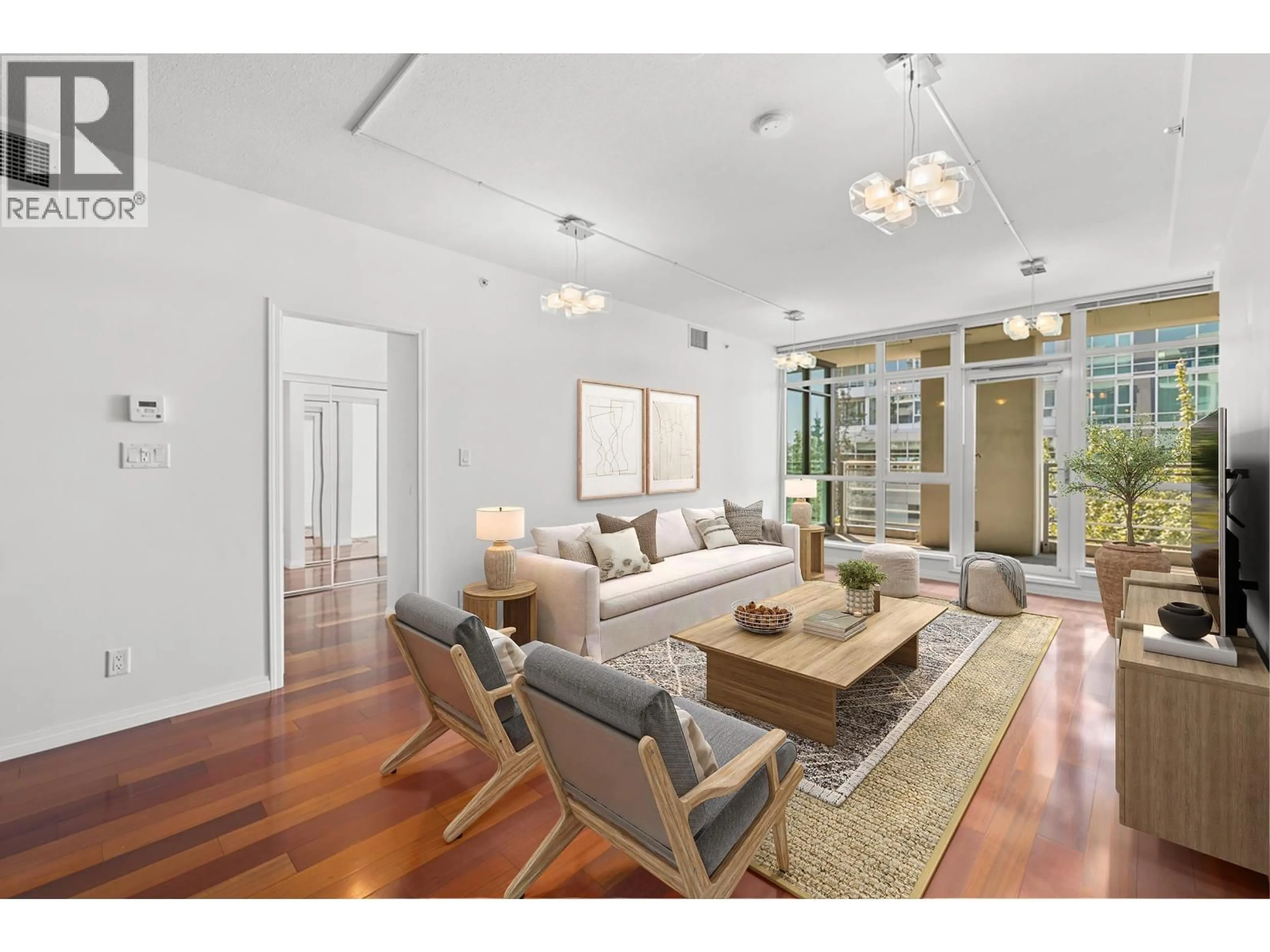 Living room with furniture, wood/laminate floor for 307 - 100 ESPLANADE AVENUE, North Vancouver British Columbia V7L4V1