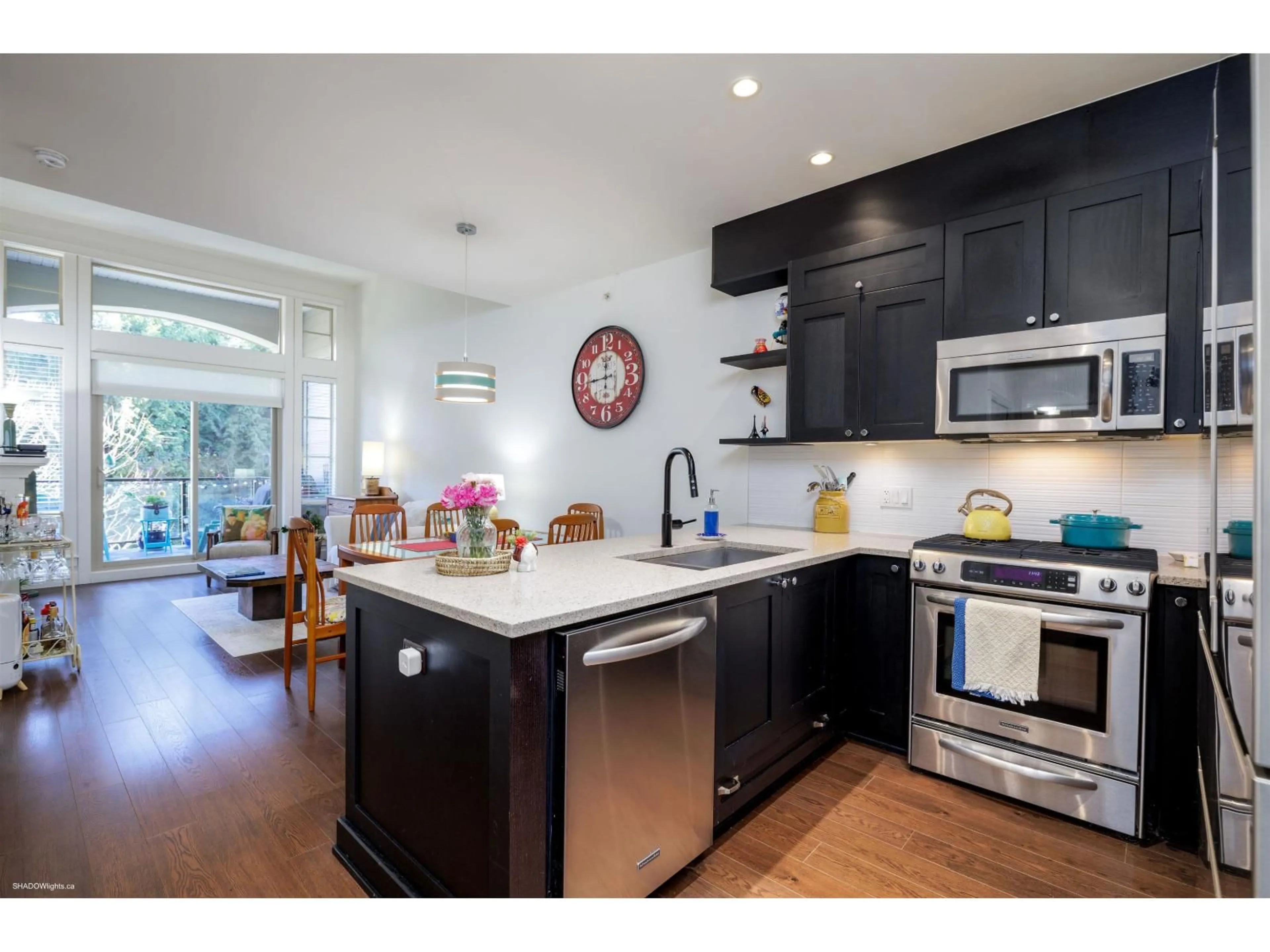 Open concept kitchen, wood/laminate floor for 308 - 15185 36, Surrey British Columbia V3S4R3