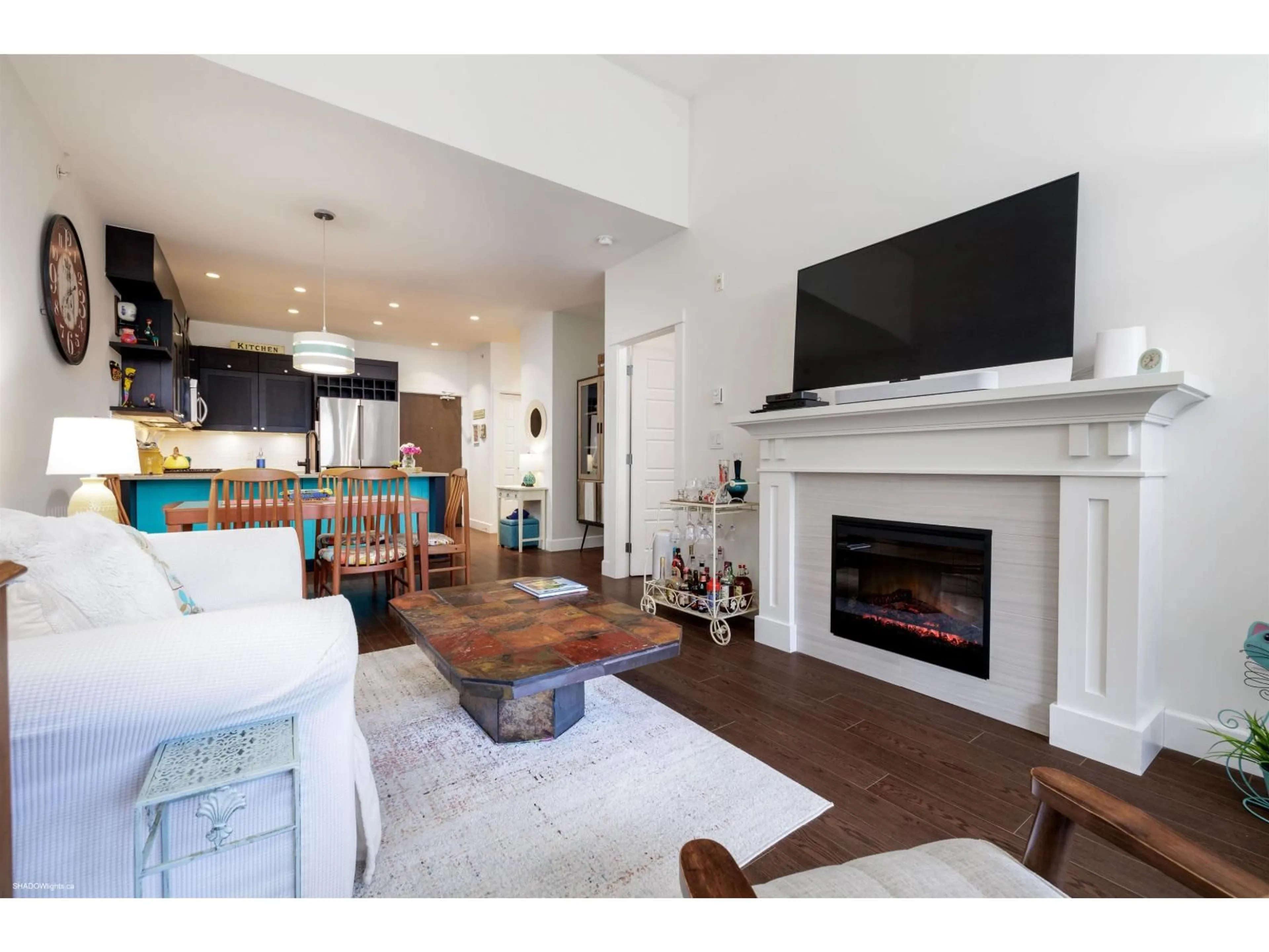 Living room with furniture, wood/laminate floor for 308 - 15185 36, Surrey British Columbia V3S4R3