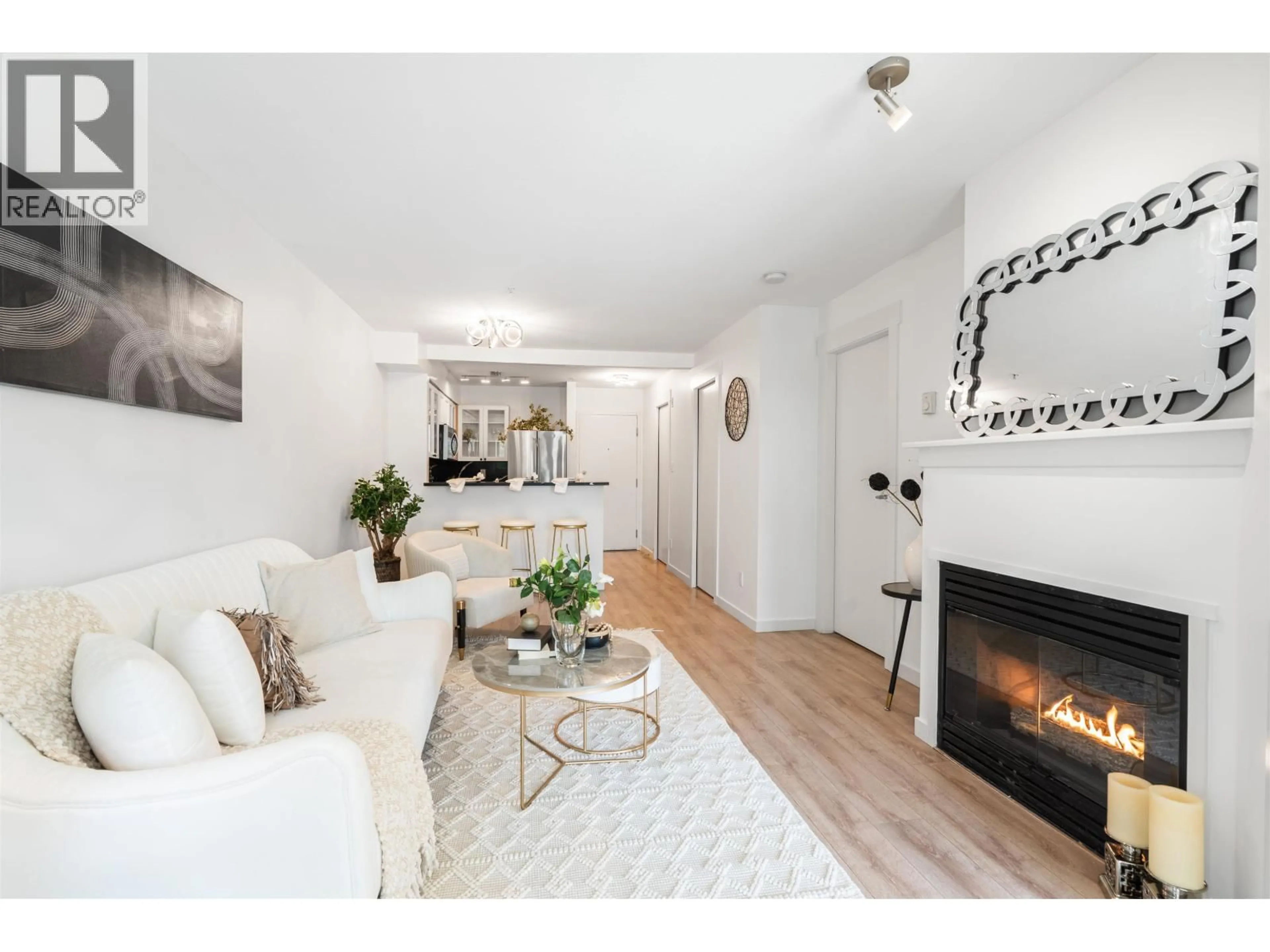 Living room with furniture, wood/laminate floor for 209 - 1503 65TH AVENUE, Vancouver British Columbia V6P6Y8
