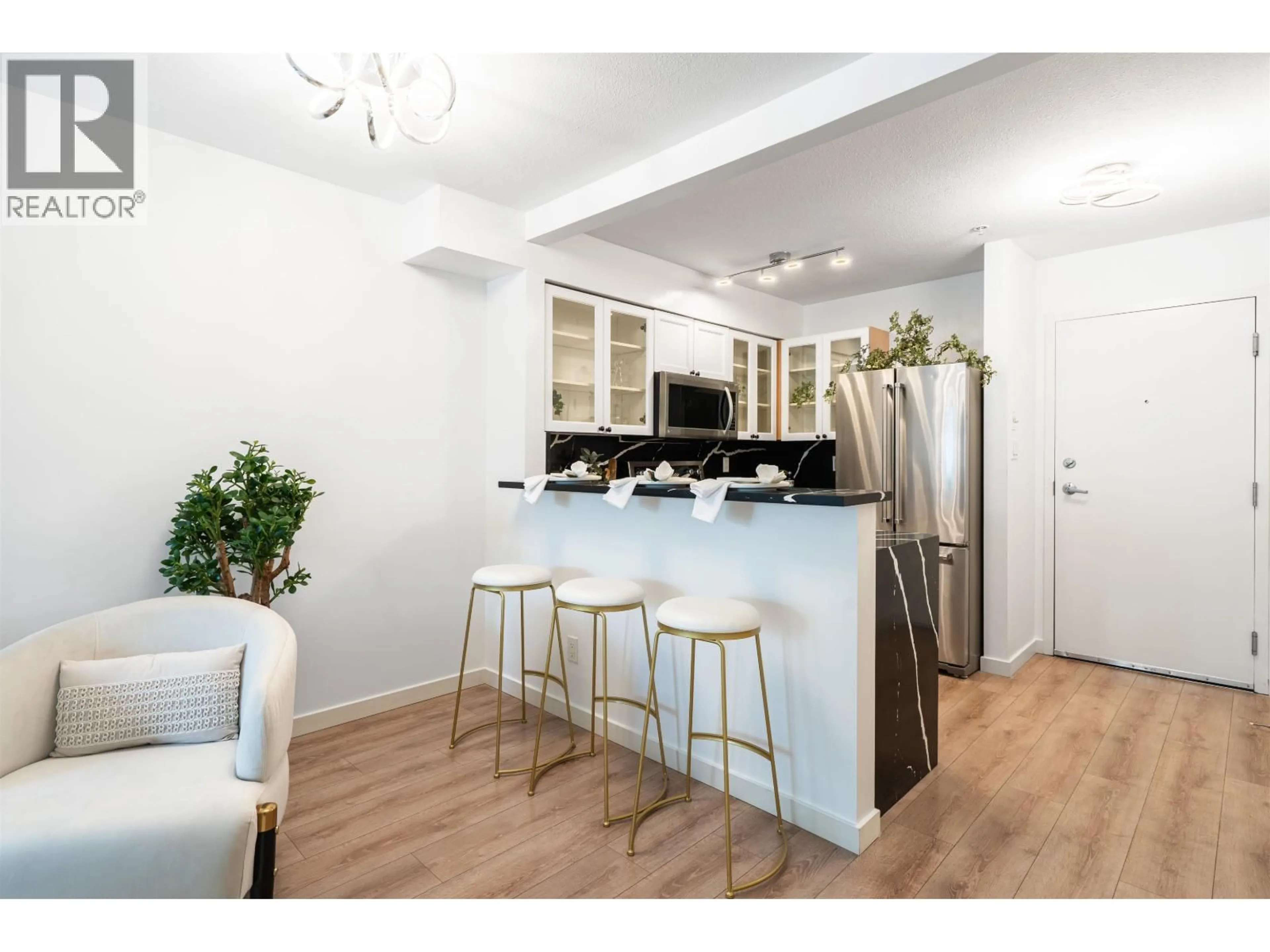 Open concept kitchen, wood/laminate floor for 209 - 1503 65TH AVENUE, Vancouver British Columbia V6P6Y8
