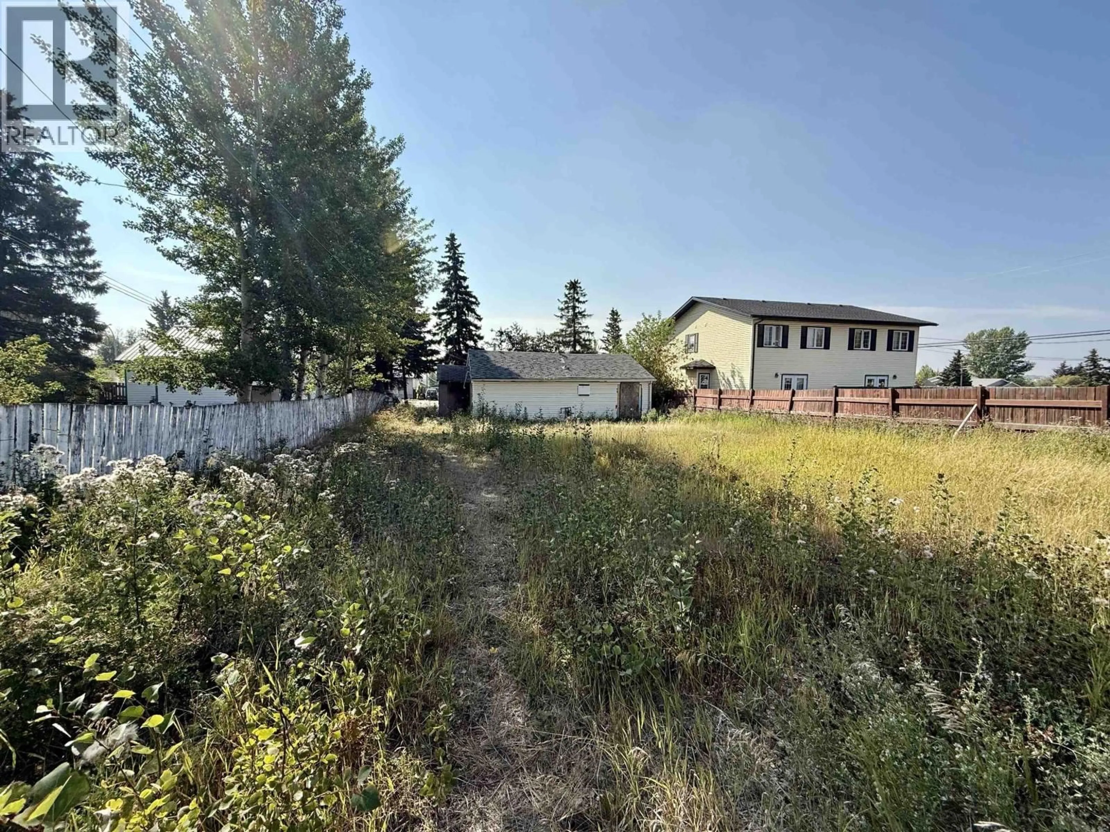 A pic from outside/outdoor area/front of a property/back of a property/a pic from drone, unknown for 9520 97 AVENUE, Fort St. John British Columbia V1J1M9