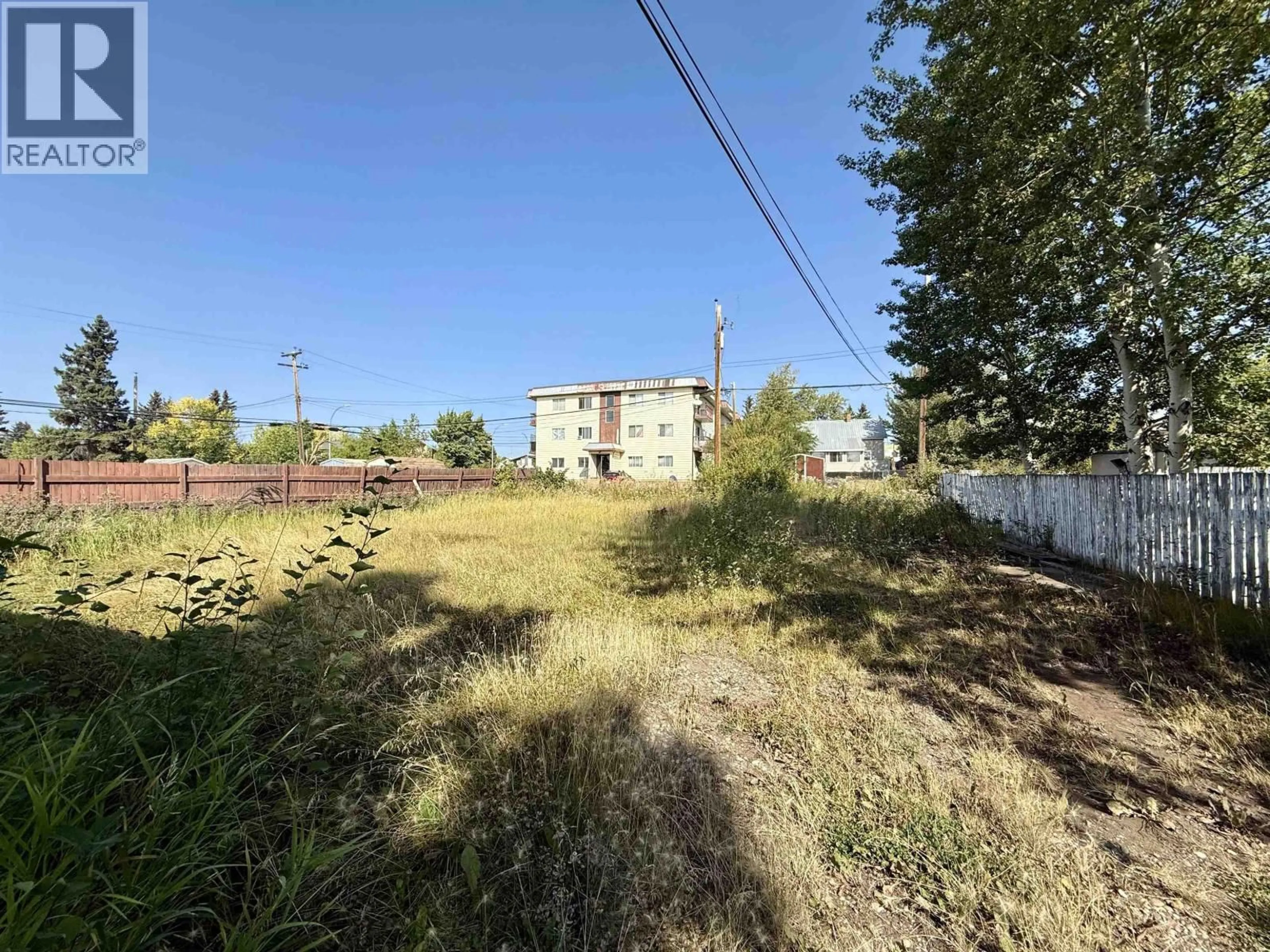 A pic from outside/outdoor area/front of a property/back of a property/a pic from drone, street for 9520 97 AVENUE, Fort St. John British Columbia V1J1M9