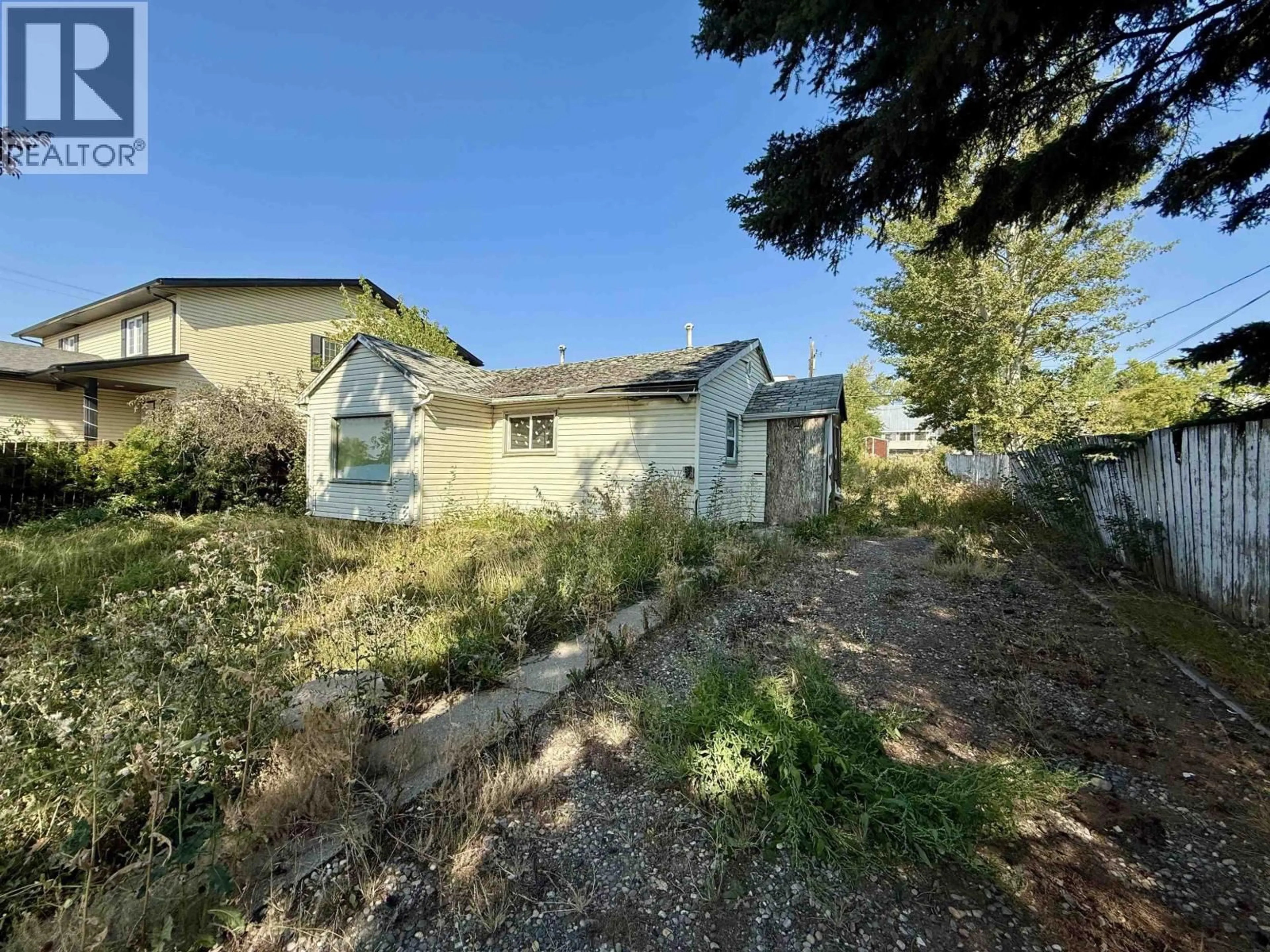 A pic from outside/outdoor area/front of a property/back of a property/a pic from drone, street for 9520 97 AVENUE, Fort St. John British Columbia V1J1M9