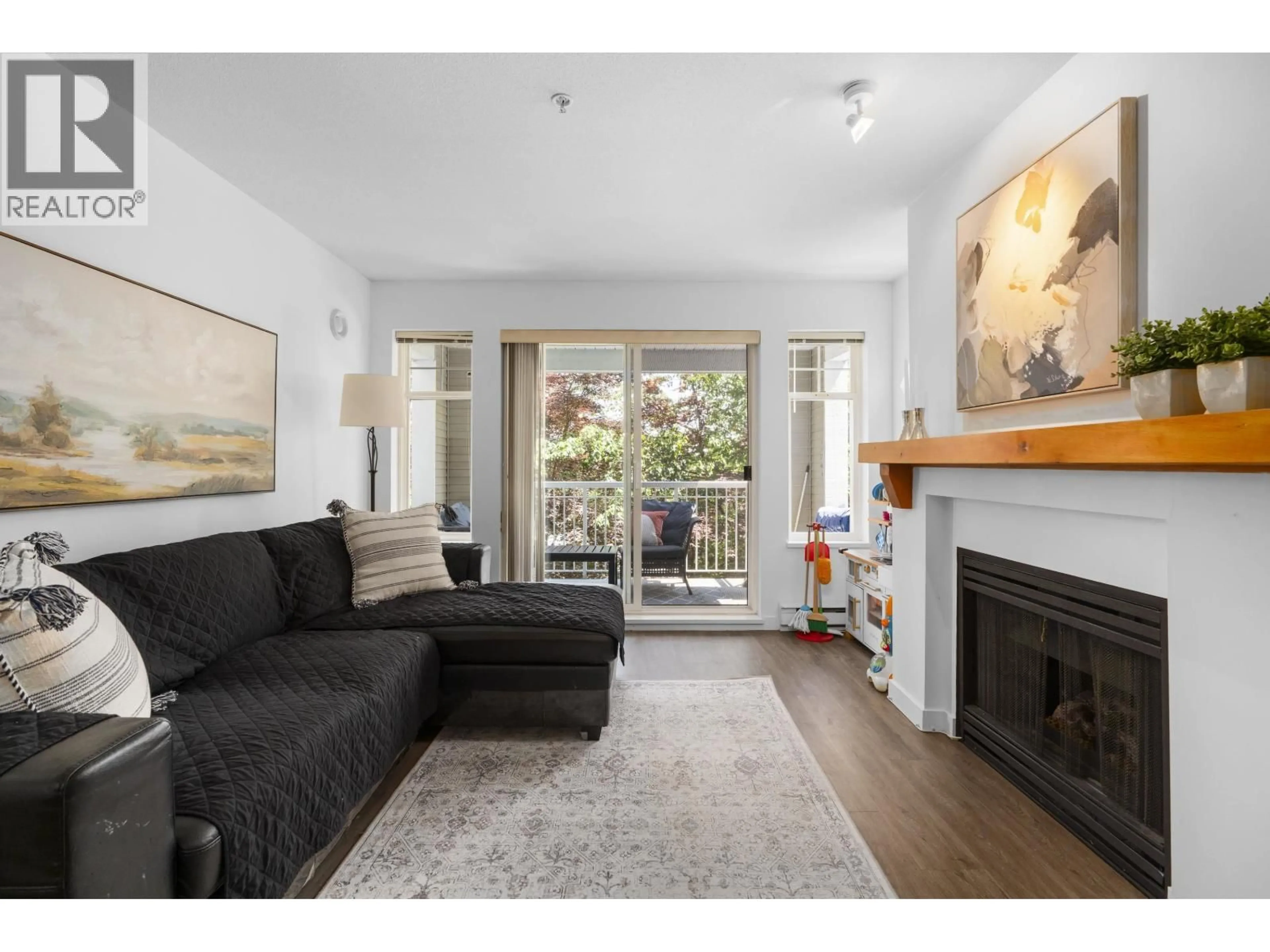 Living room with furniture, wood/laminate floor for 212 - 1432 PARKWAY BOULEVARD, Coquitlam British Columbia V3E3L9