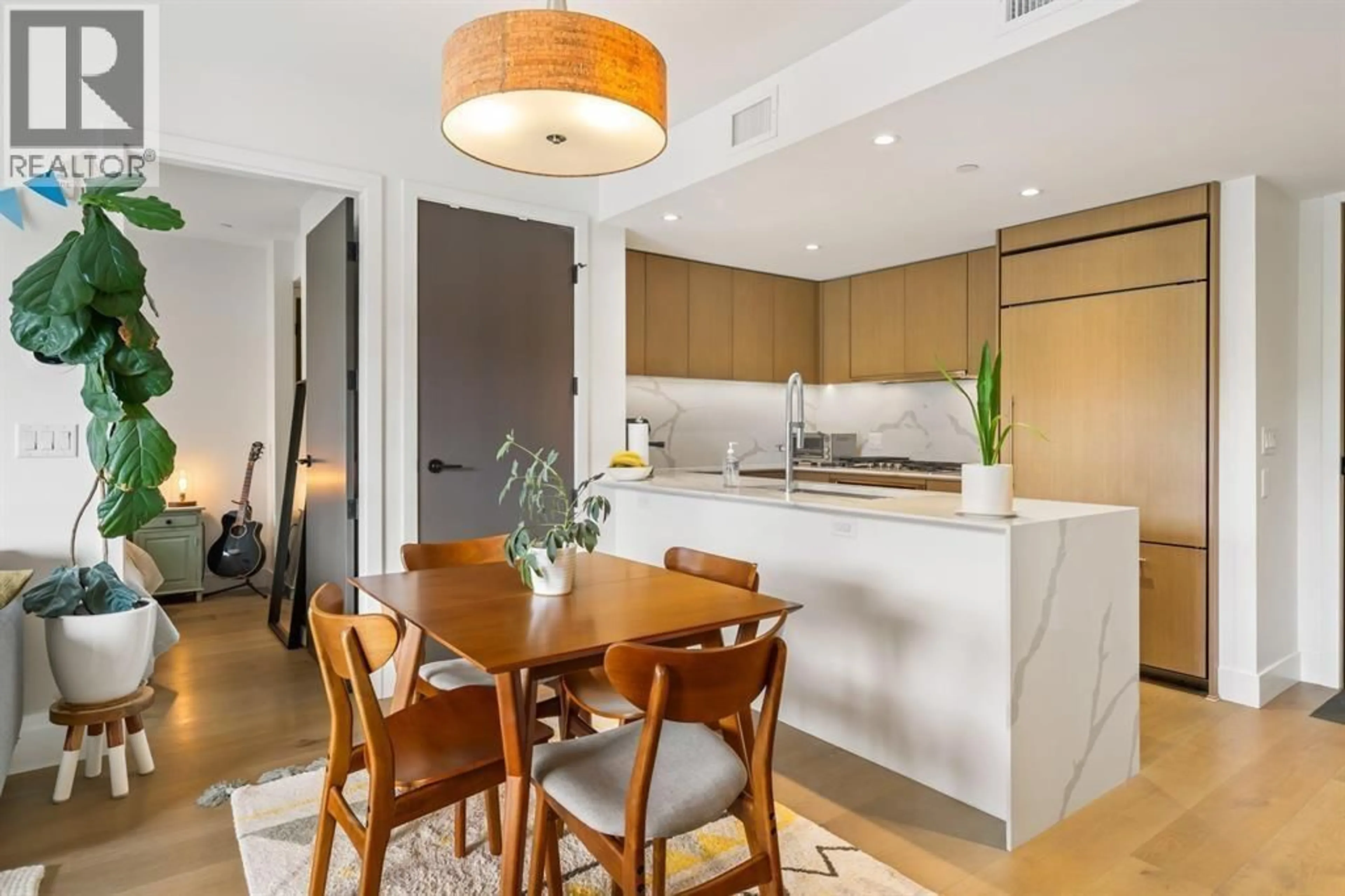 Open concept kitchen, wood/laminate floor for 201 - 5089 QUEBEC STREET, Vancouver British Columbia V5W0E5