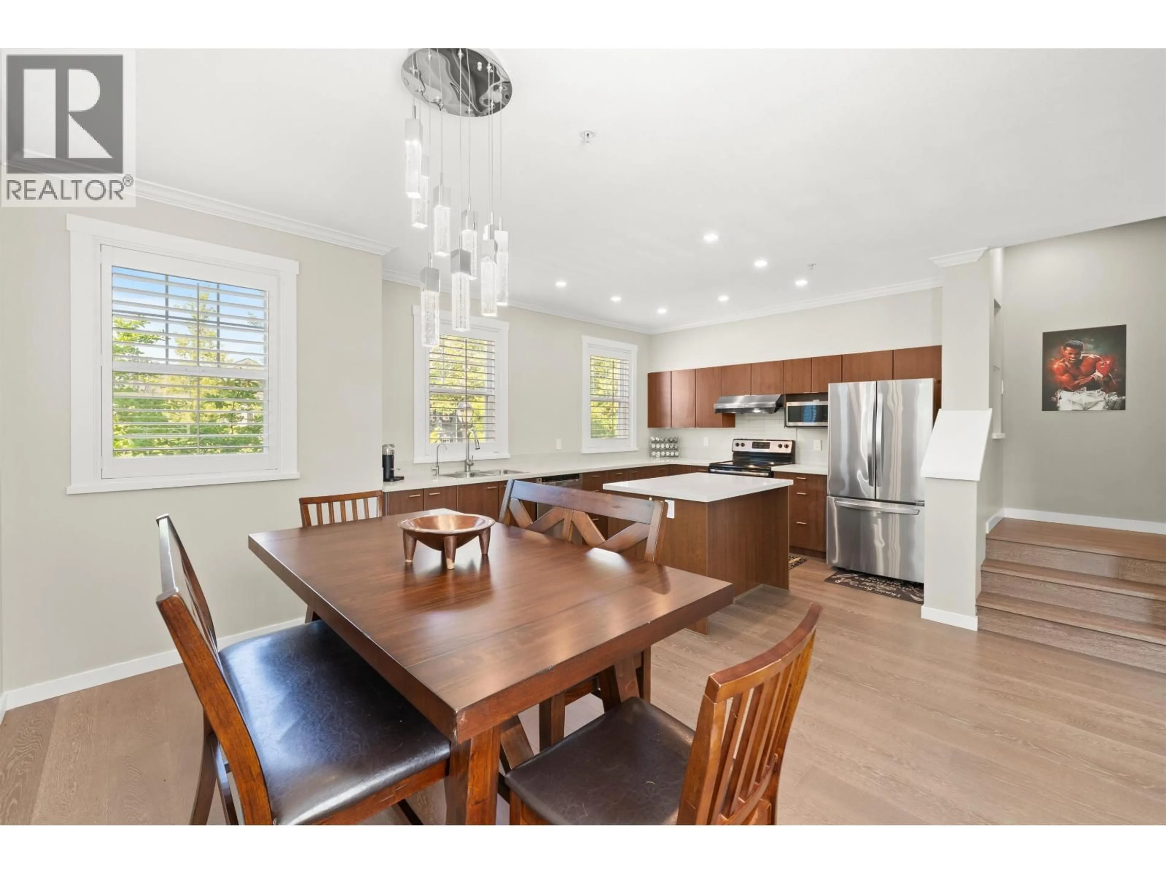 Open concept kitchen, wood/laminate floor for 15 - 19572 FRASER WAY, Pitt Meadows British Columbia V3Y0A9
