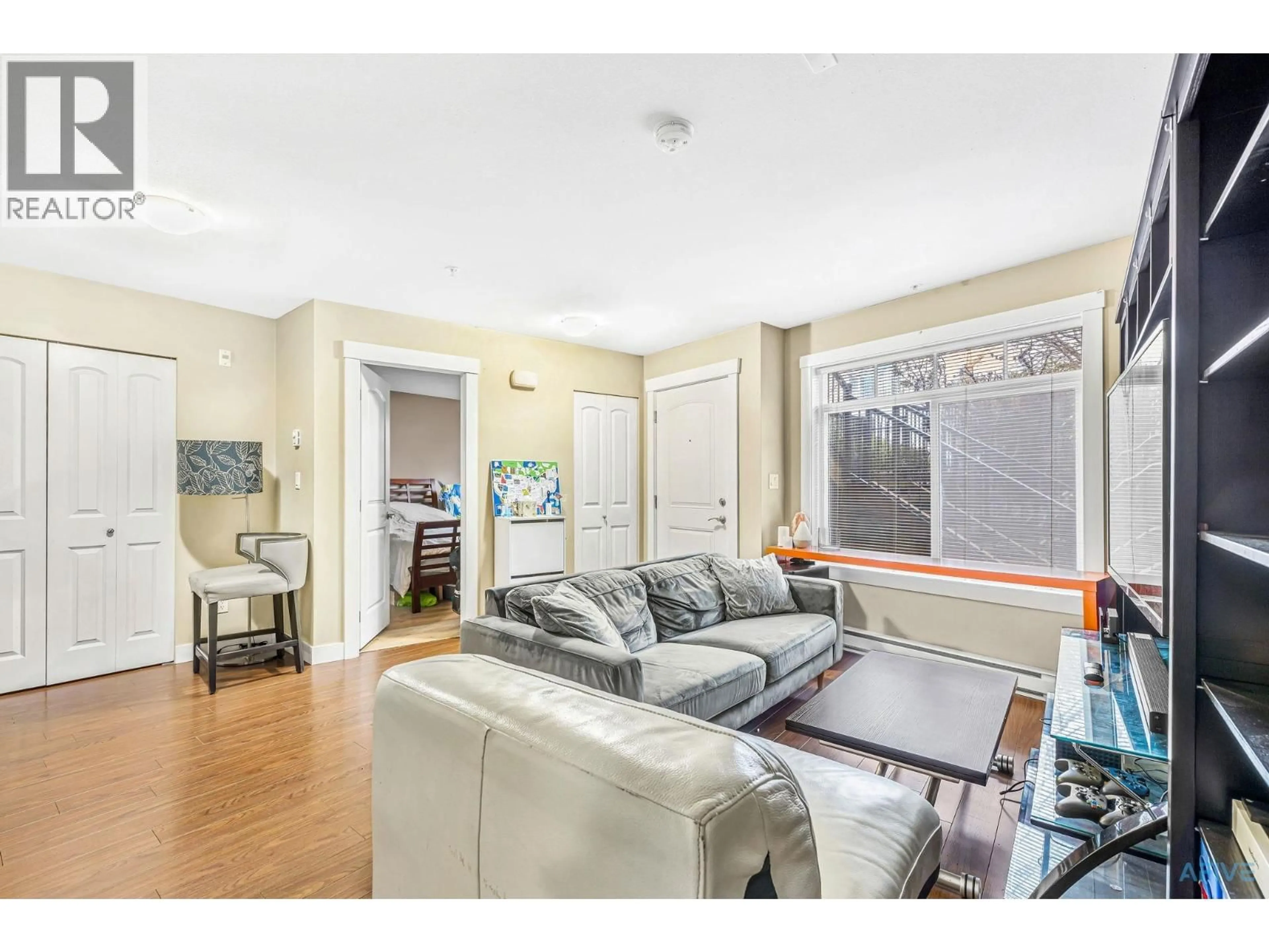 Living room with furniture, unknown for 11 - 7428 14TH AVENUE, Burnaby British Columbia V3N0C2