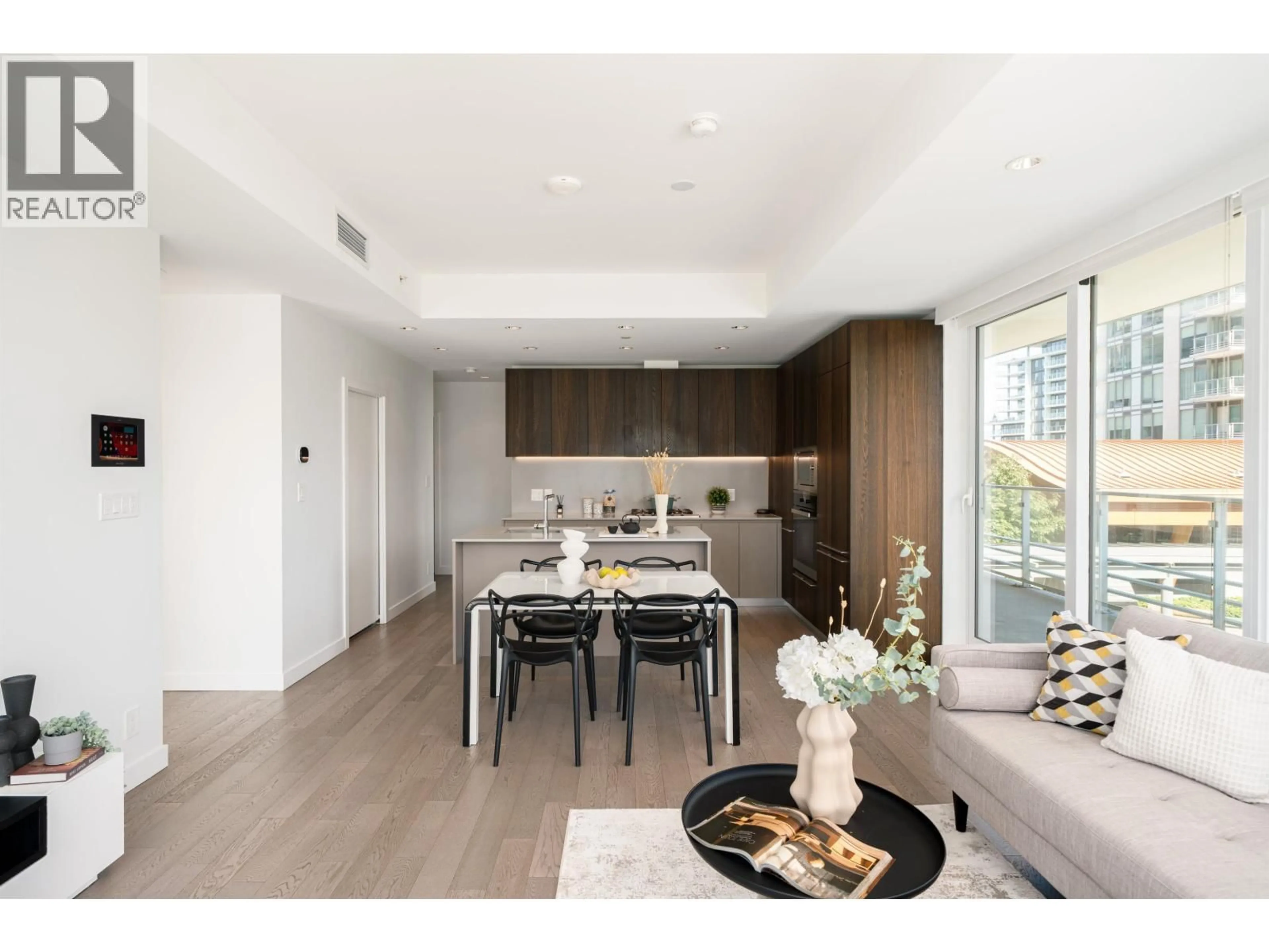 Open concept kitchen, wood/laminate floor for 310 - 6622 PEARSON WAY, Richmond British Columbia V7C0E4
