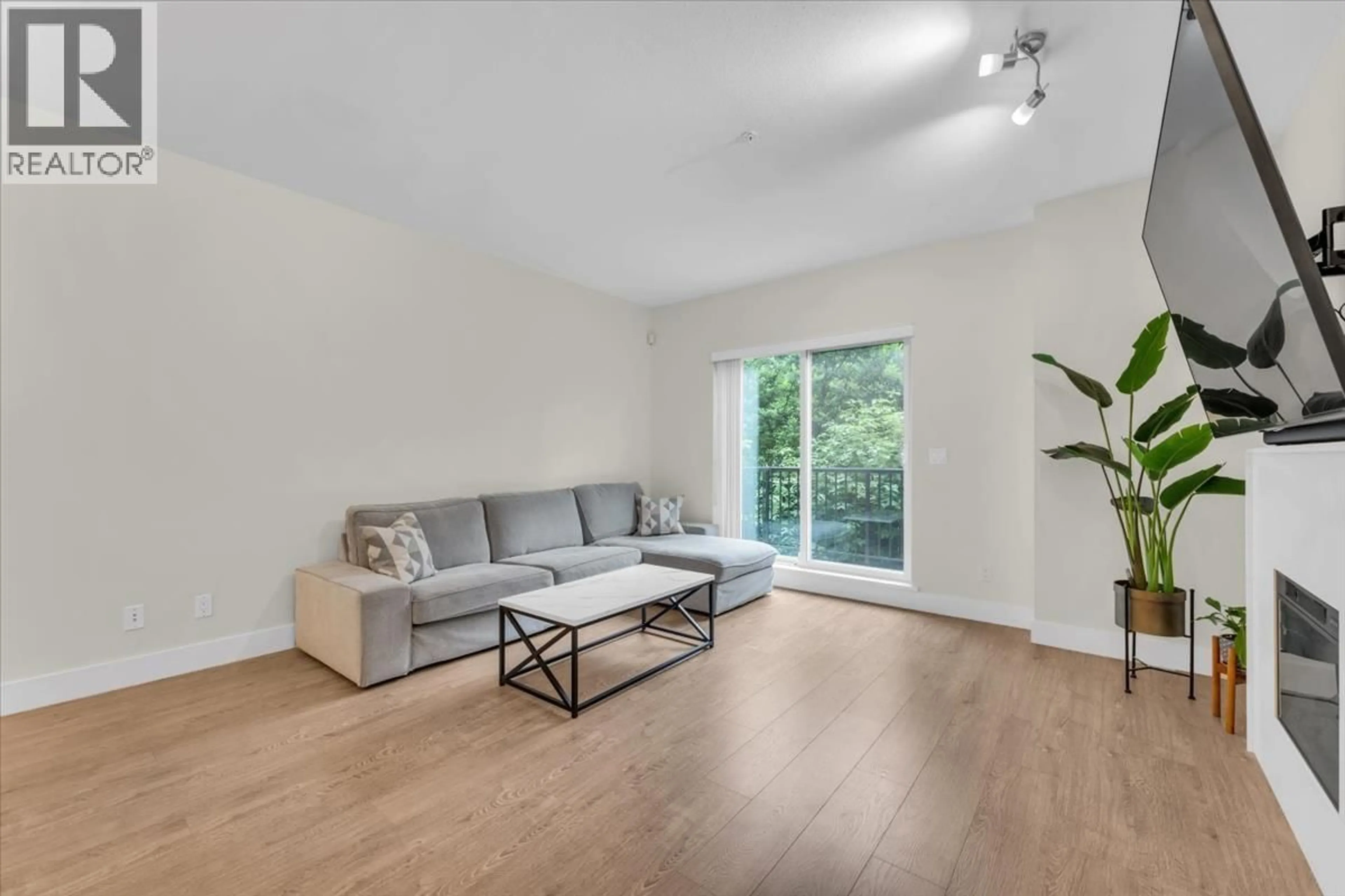 Living room with furniture, wood/laminate floor for 206 - 3888 NORFOLK STREET, Burnaby British Columbia V5G1E5