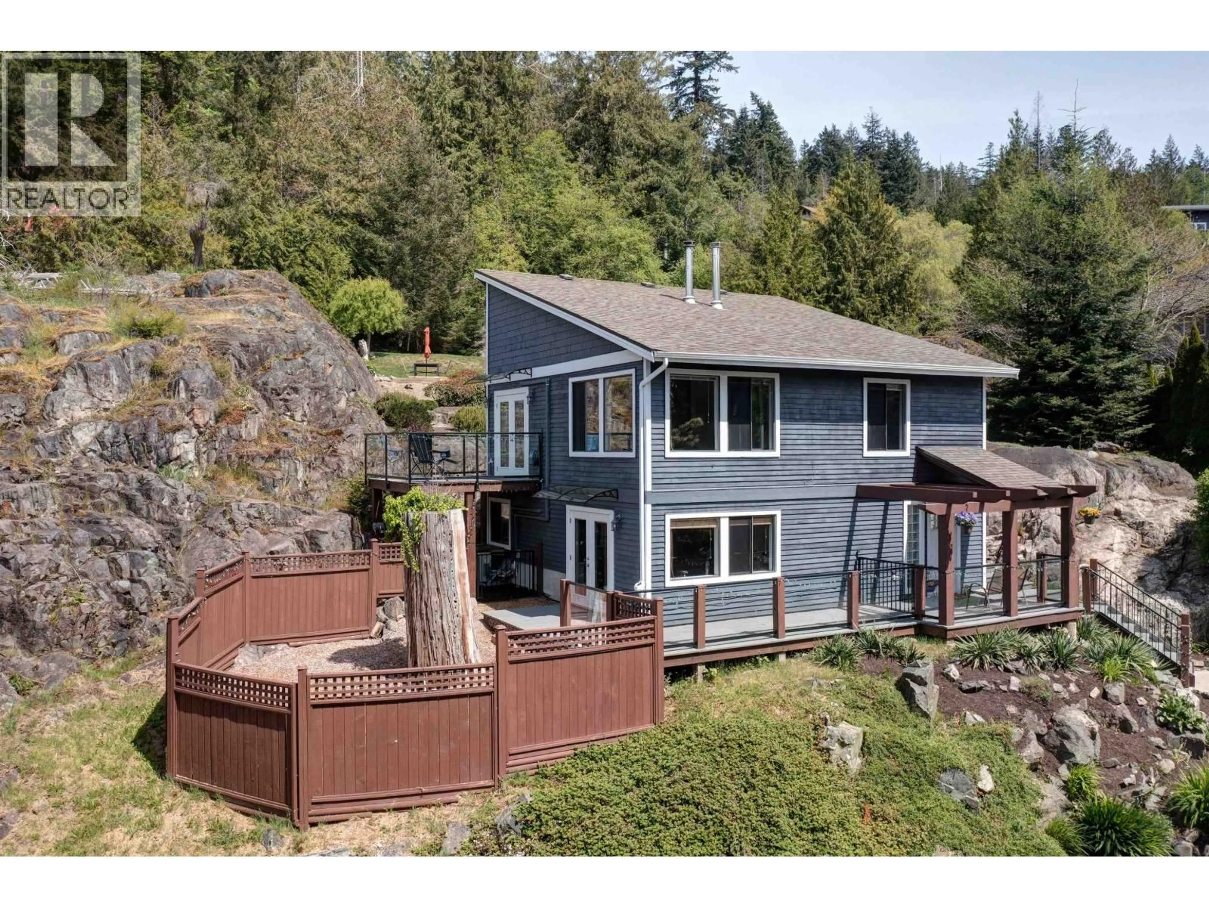 A pic from outside/outdoor area/front of a property/back of a property/a pic from drone, water/lake/river/ocean view for 8362 REDROOFFS ROAD, Halfmoon Bay British Columbia V7Z1E5