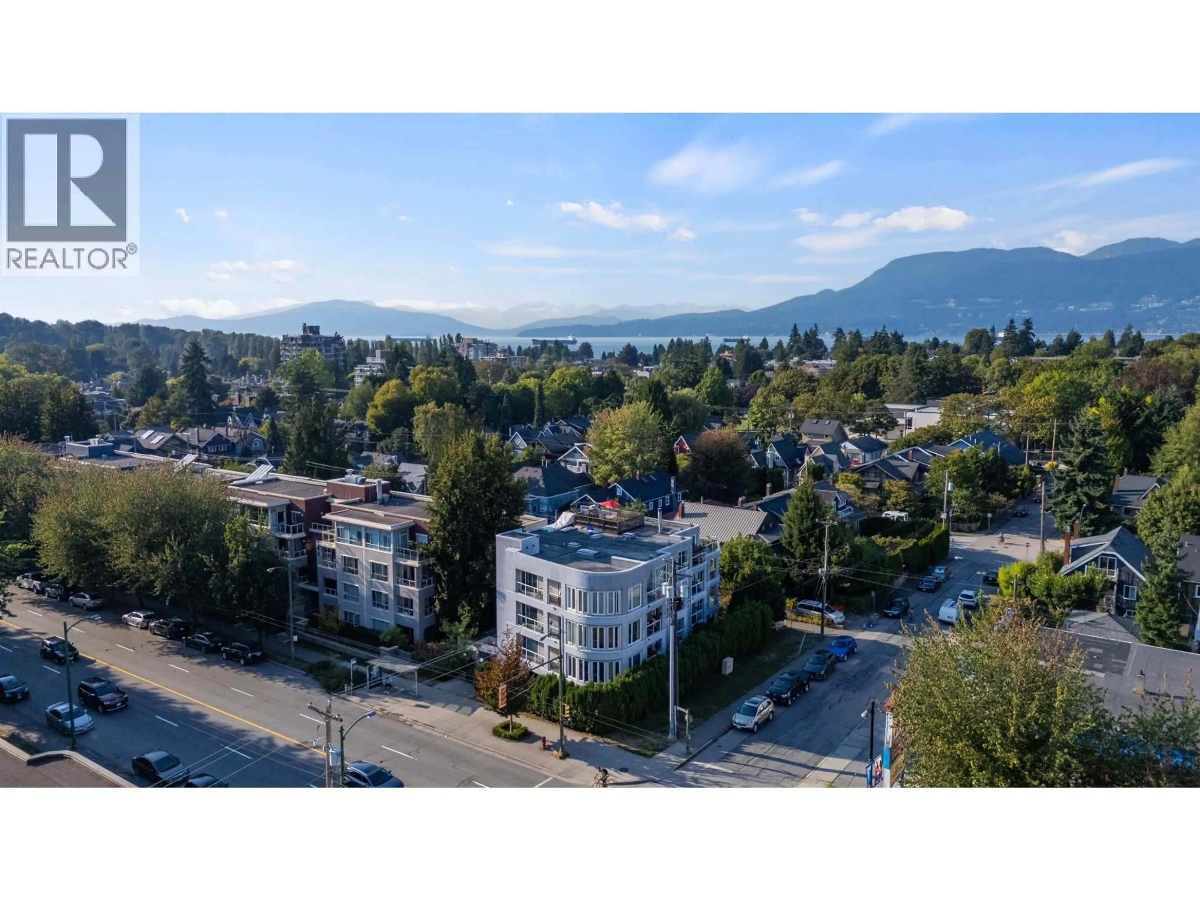 A pic from outside/outdoor area/front of a property/back of a property/a pic from drone, mountain view for 403 - 3505 BROADWAY, Vancouver British Columbia V6R2B5