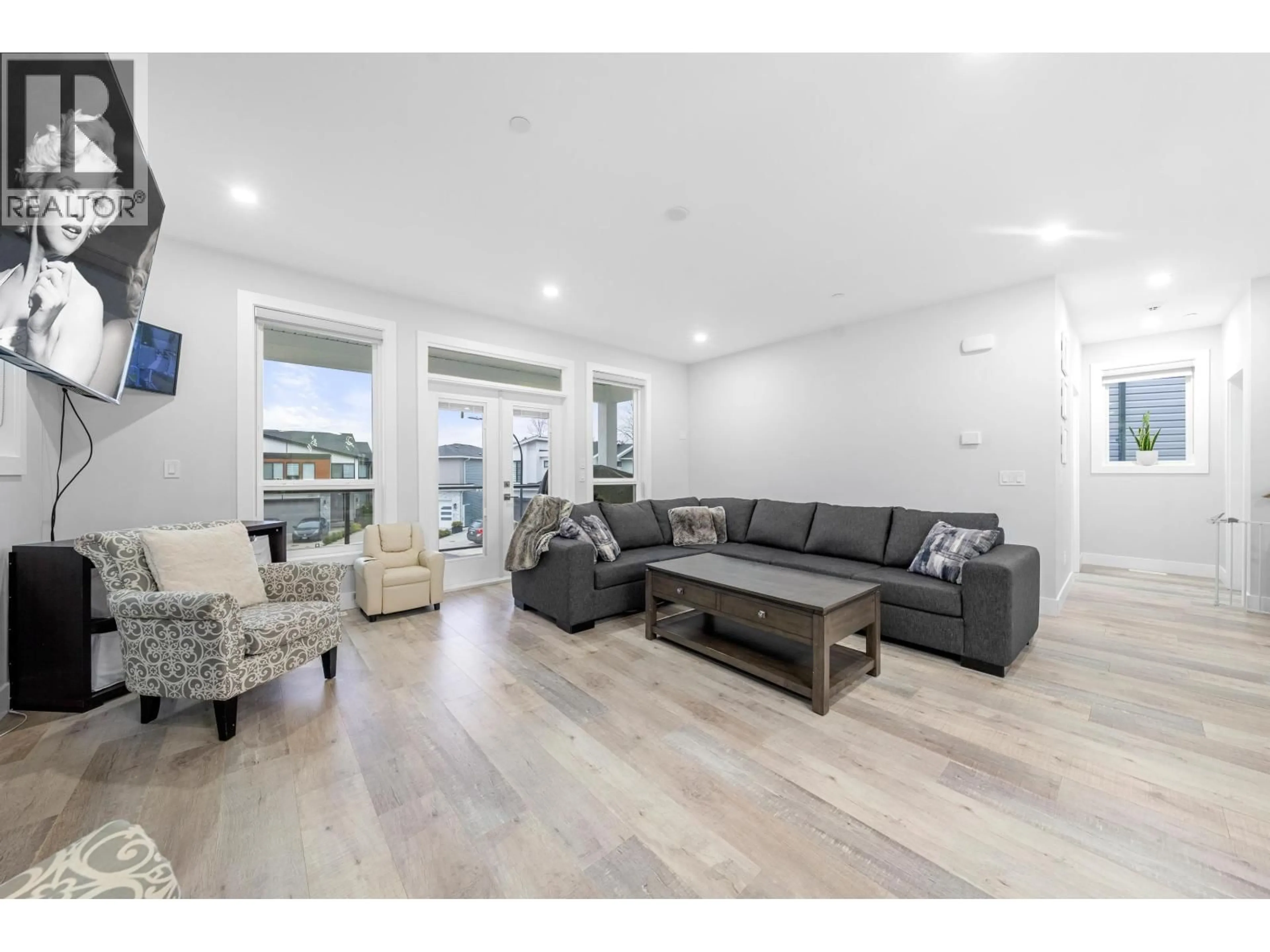 Living room with furniture, wood/laminate floor for 24629 105A AVENUE, Maple Ridge British Columbia V2W0K3