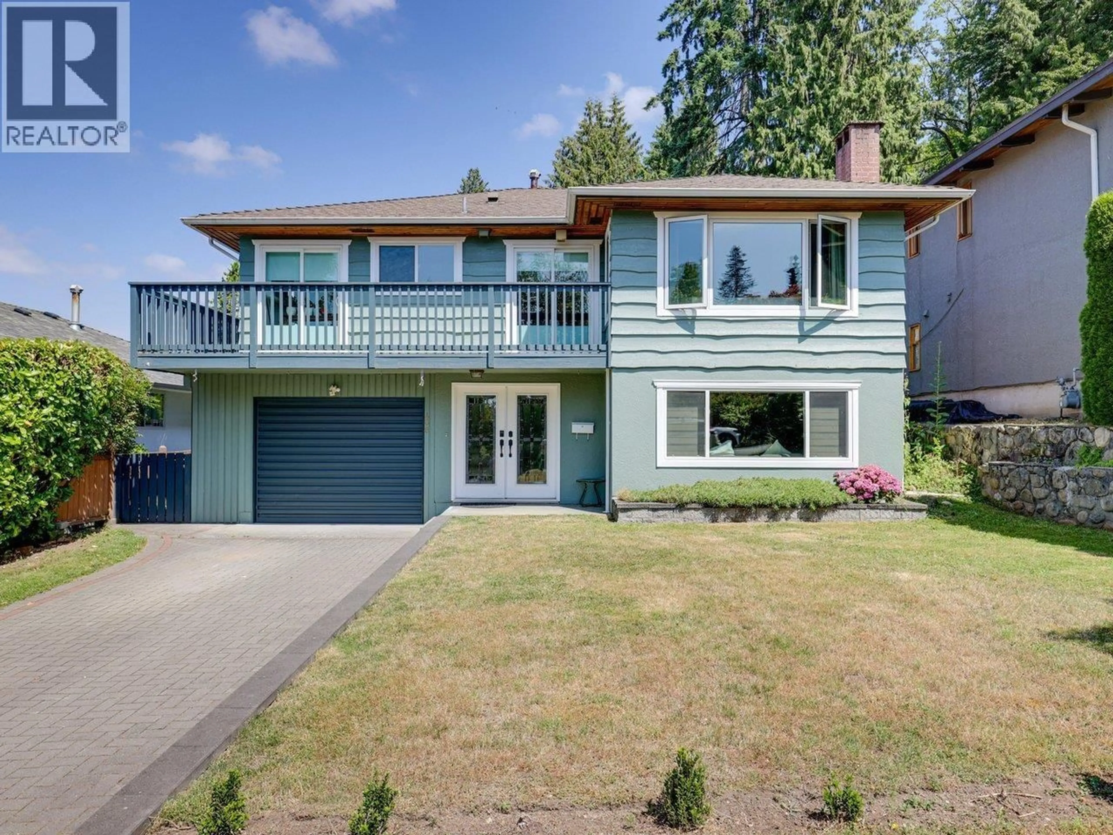 Home with vinyl exterior material, street for 408 18TH STREET, North Vancouver British Columbia V7L2Y2