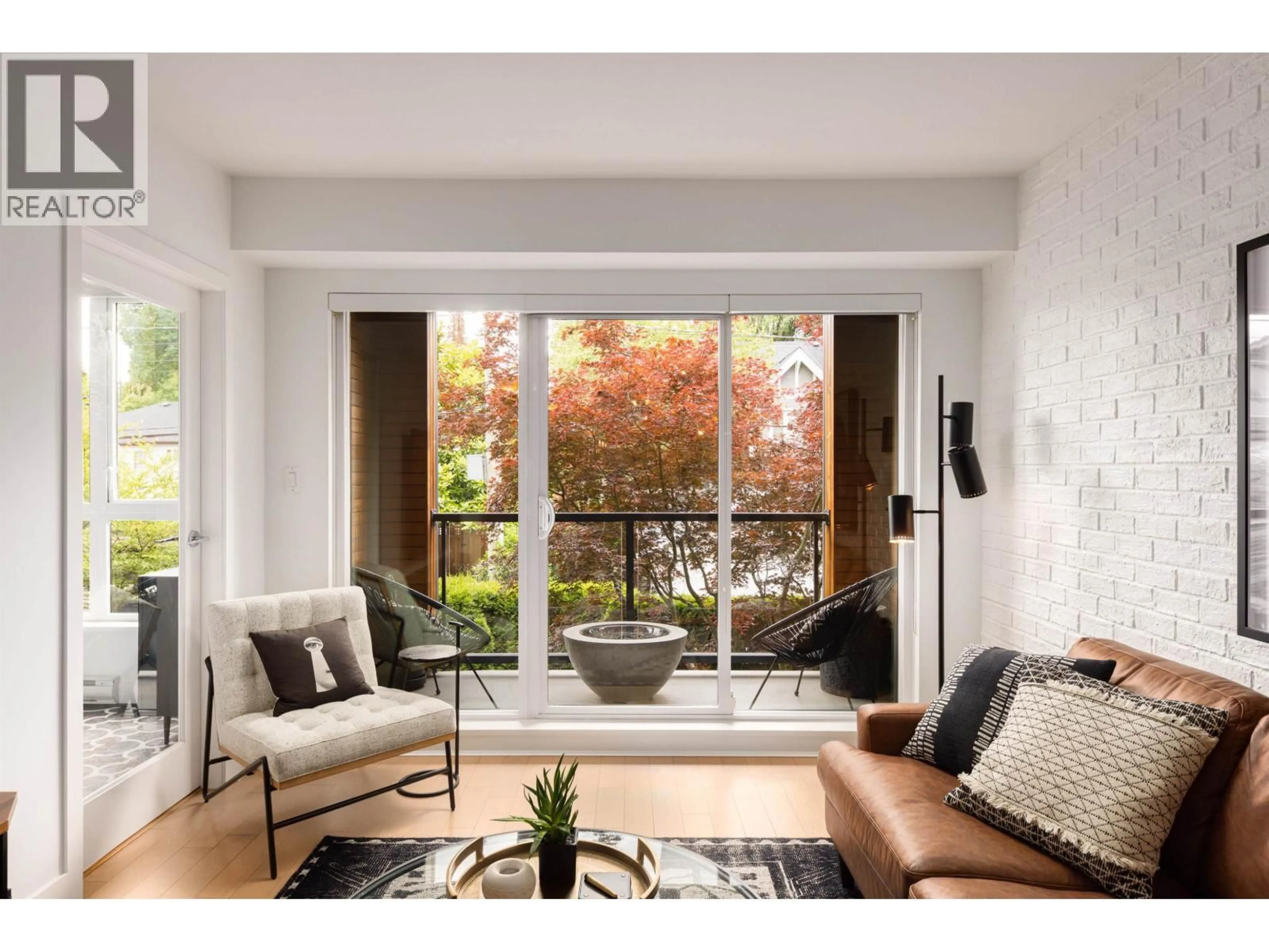 Living room with furniture, wood/laminate floor for 203 - 2020 12TH AVENUE, Vancouver British Columbia V6J0C5