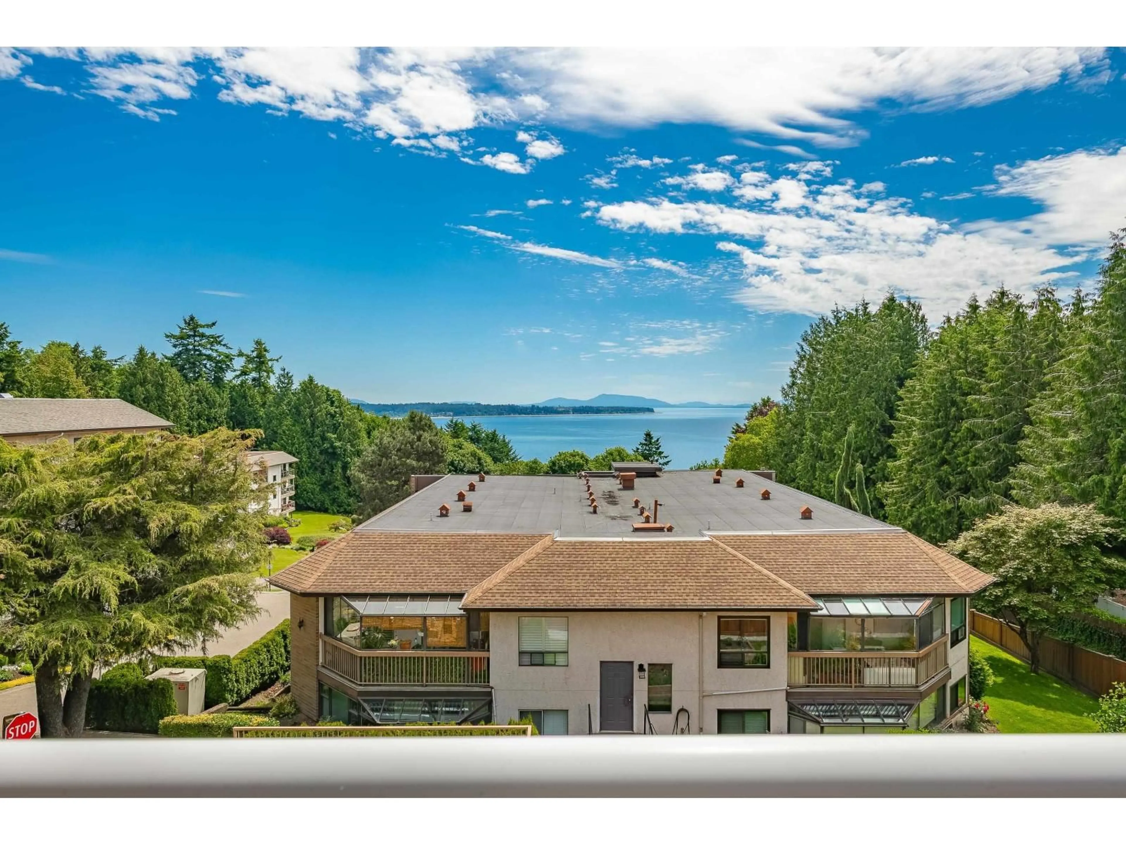 A pic from outside/outdoor area/front of a property/back of a property/a pic from drone, water/lake/river/ocean view for 104 - 14934 THRIFT, White Rock British Columbia V4B2J9