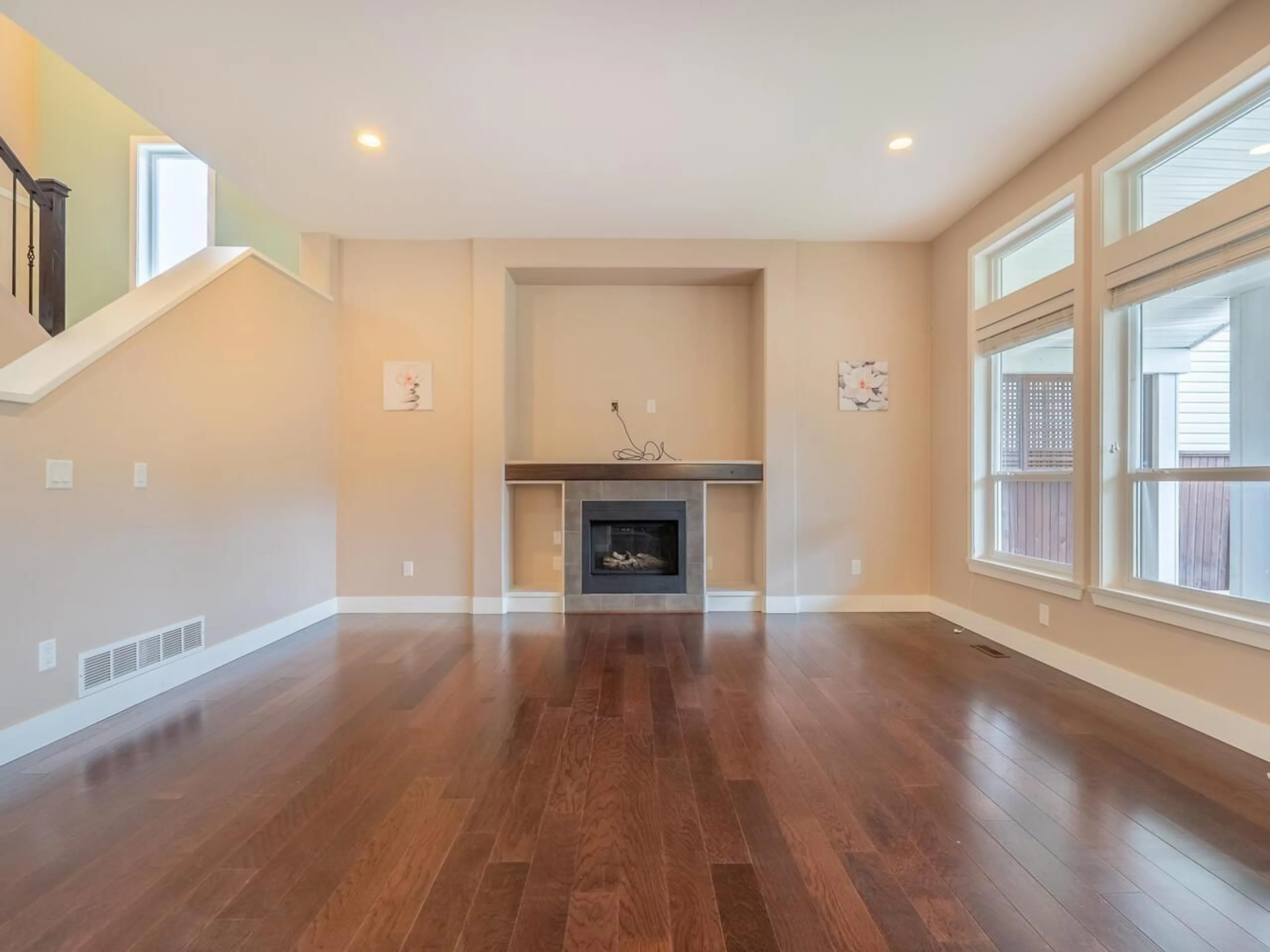 Living room with furniture, wood/laminate floor for 7758 169A, Surrey British Columbia V4N6L2