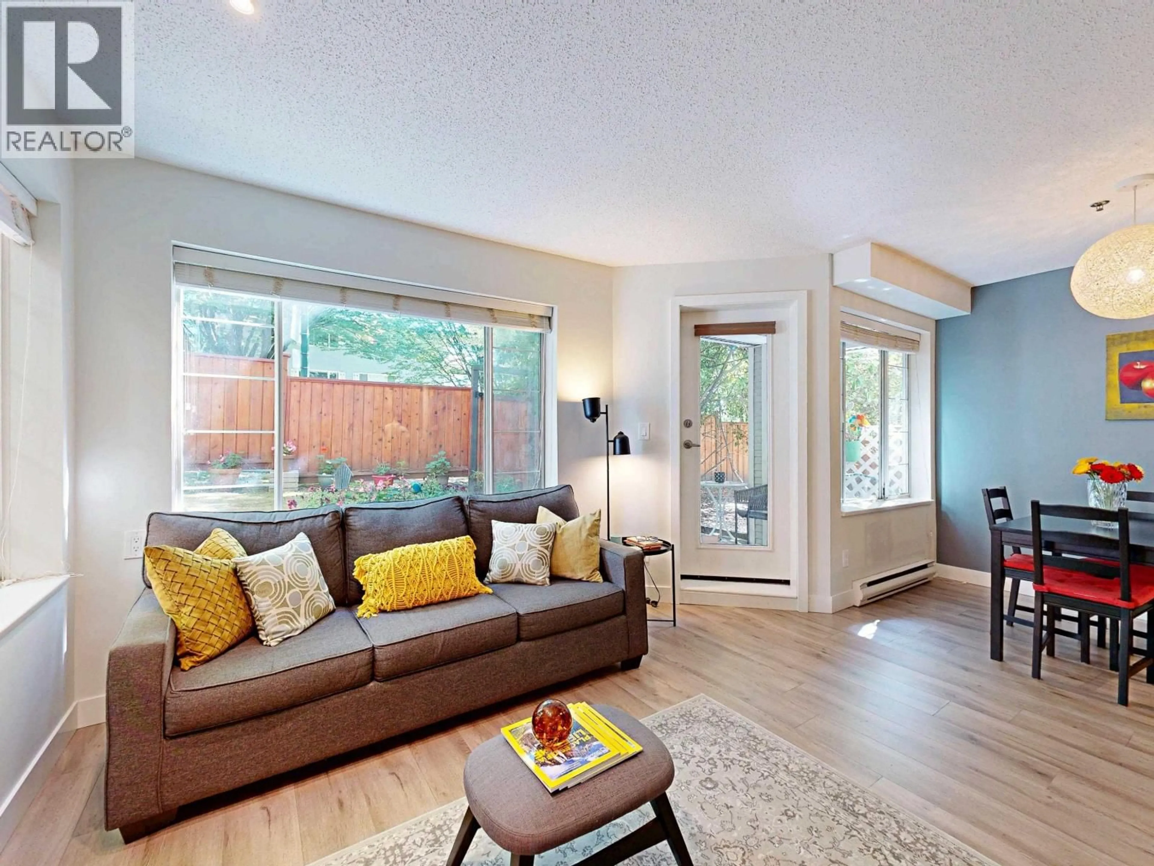 Living room with furniture, wood/laminate floor for 105 - 1433 1ST AVENUE, Vancouver British Columbia V5N1A4