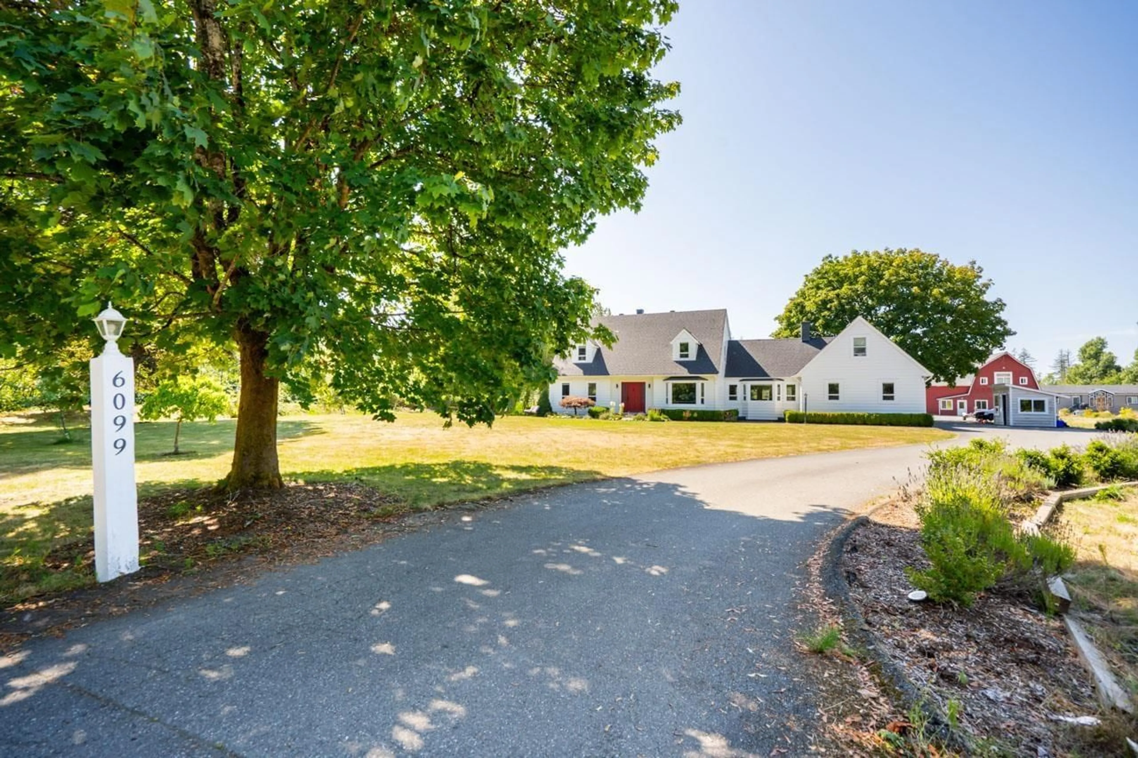 A pic from outside/outdoor area/front of a property/back of a property/a pic from drone, street for 6099 228, Langley British Columbia V2Y2L3