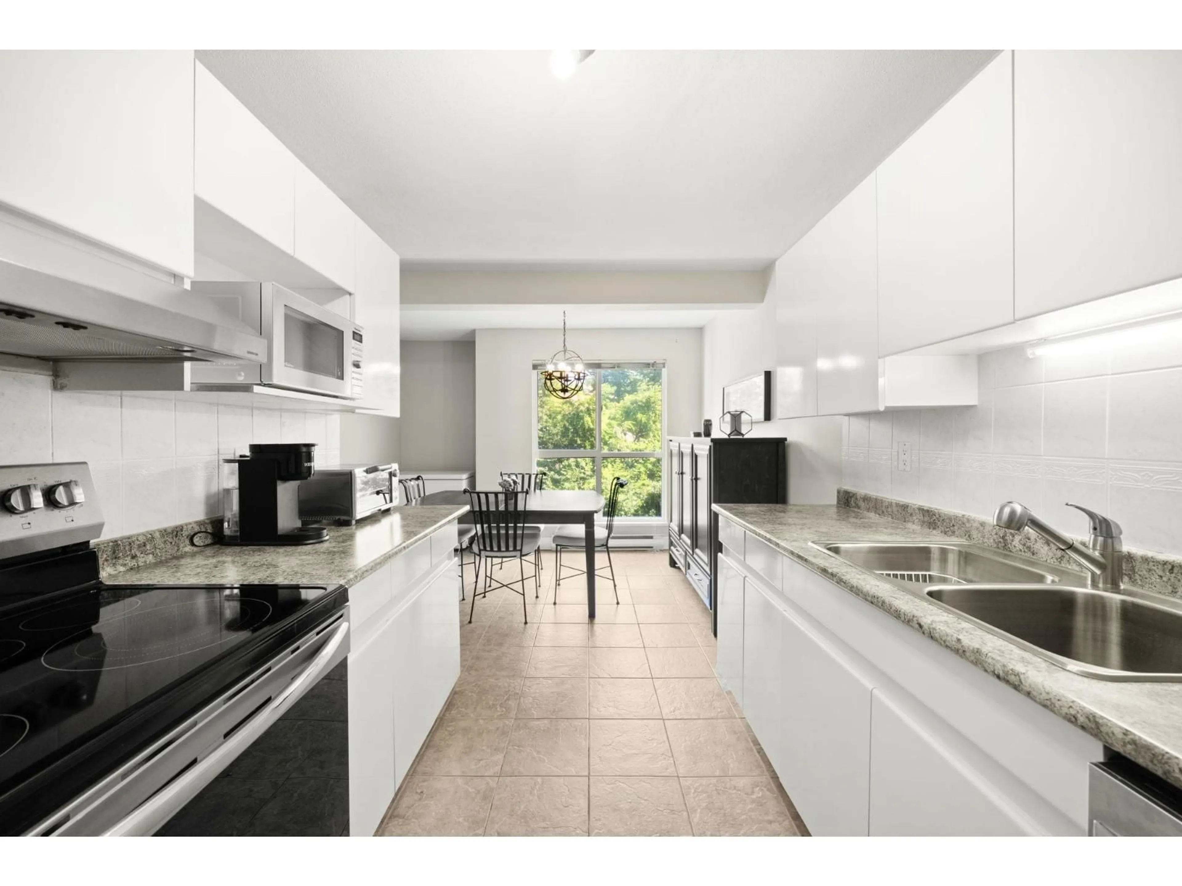 Standard kitchen, ceramic/tile floor for 204 - 14988 101A, Surrey British Columbia V3R0T1