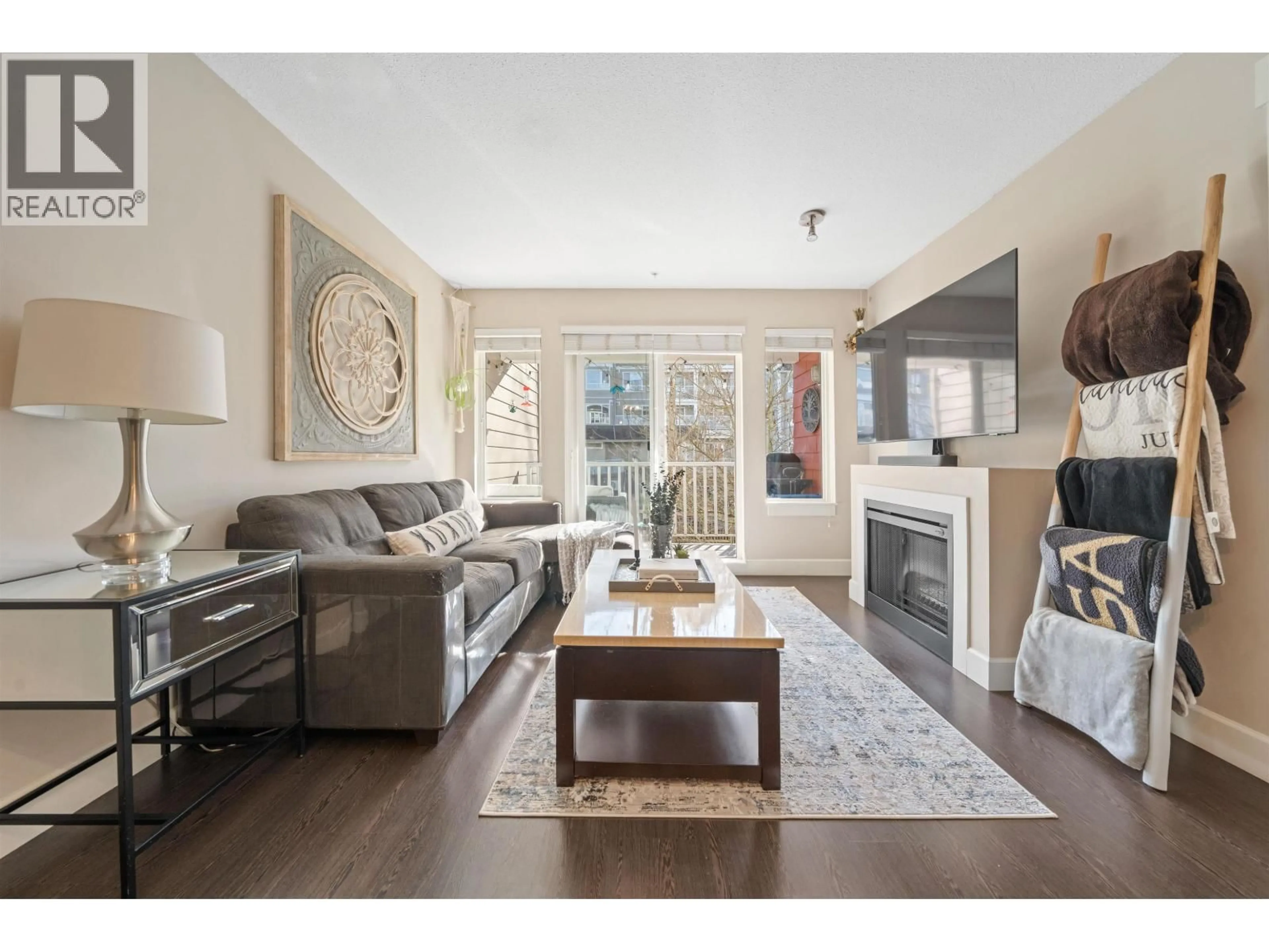 Living room with furniture, wood/laminate floor for 213 - 12283 224 STREET, Maple Ridge British Columbia V2X8Z3