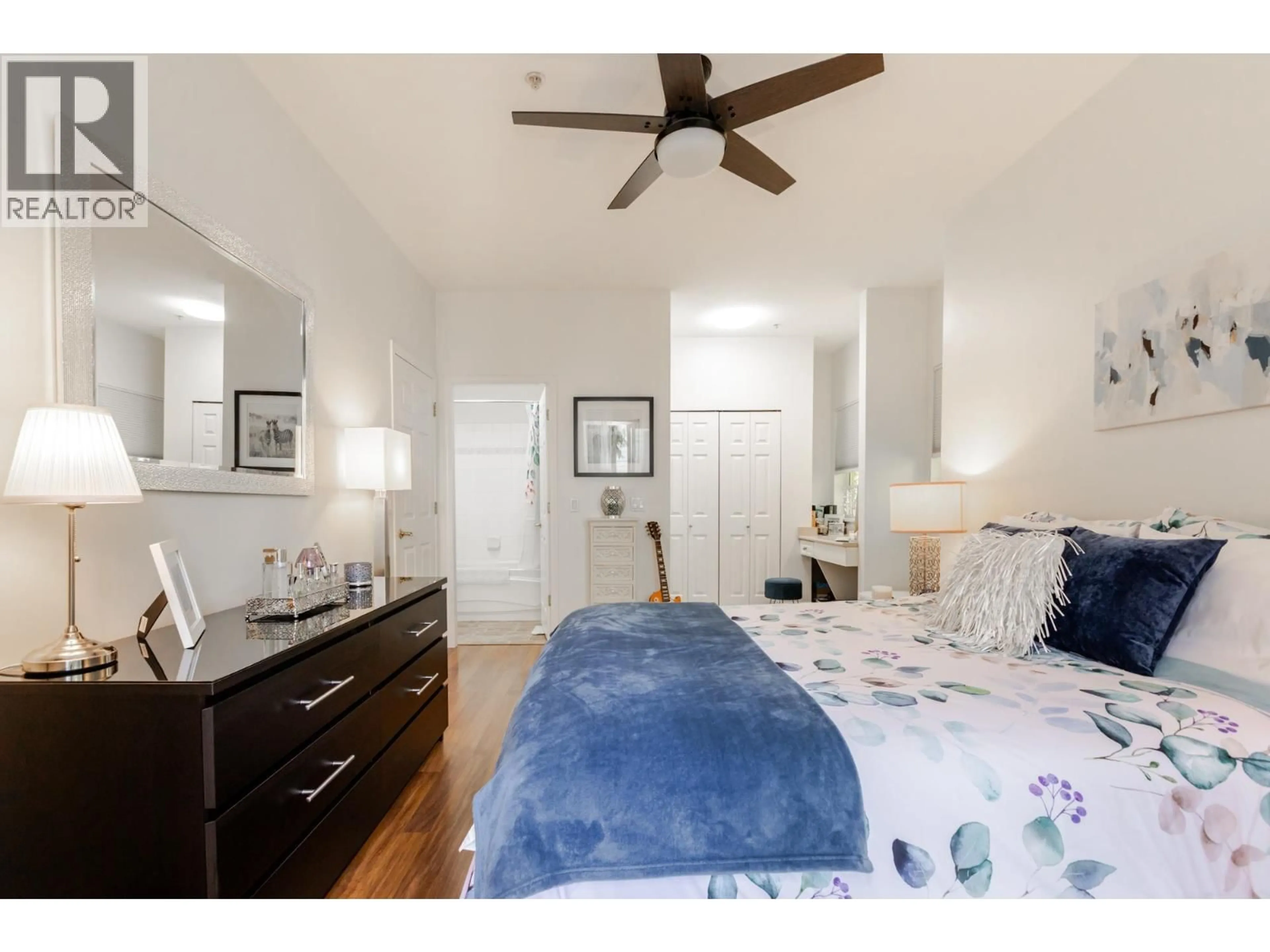 Bedroom with bed, wood/laminate floor for 205 - 4747 54A STREET, Ladner British Columbia V4K2Z9