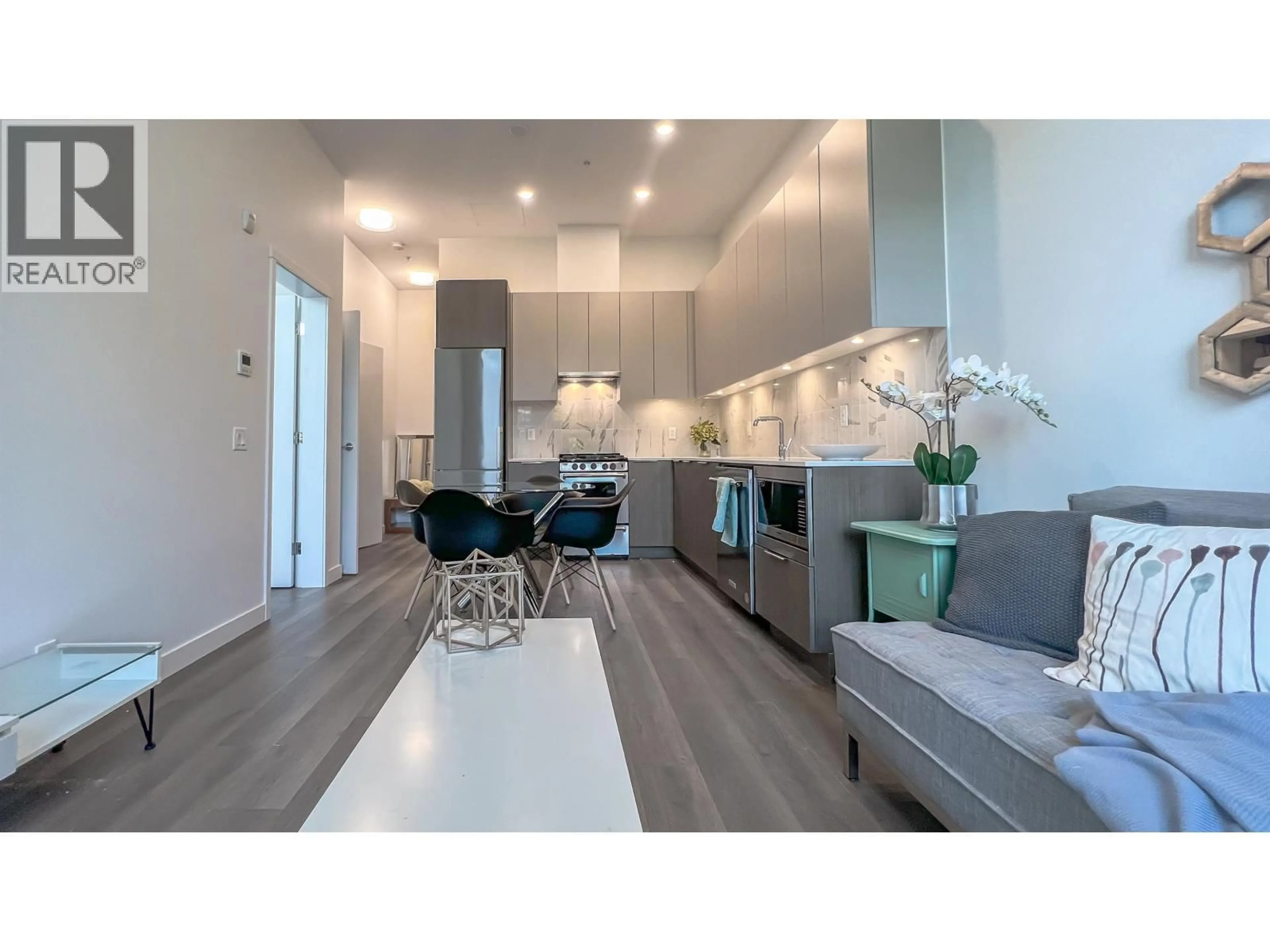 Open concept kitchen, wood/laminate floor for 111 - 645 COMO LAKE AVENUE, Coquitlam British Columbia V3J0N9