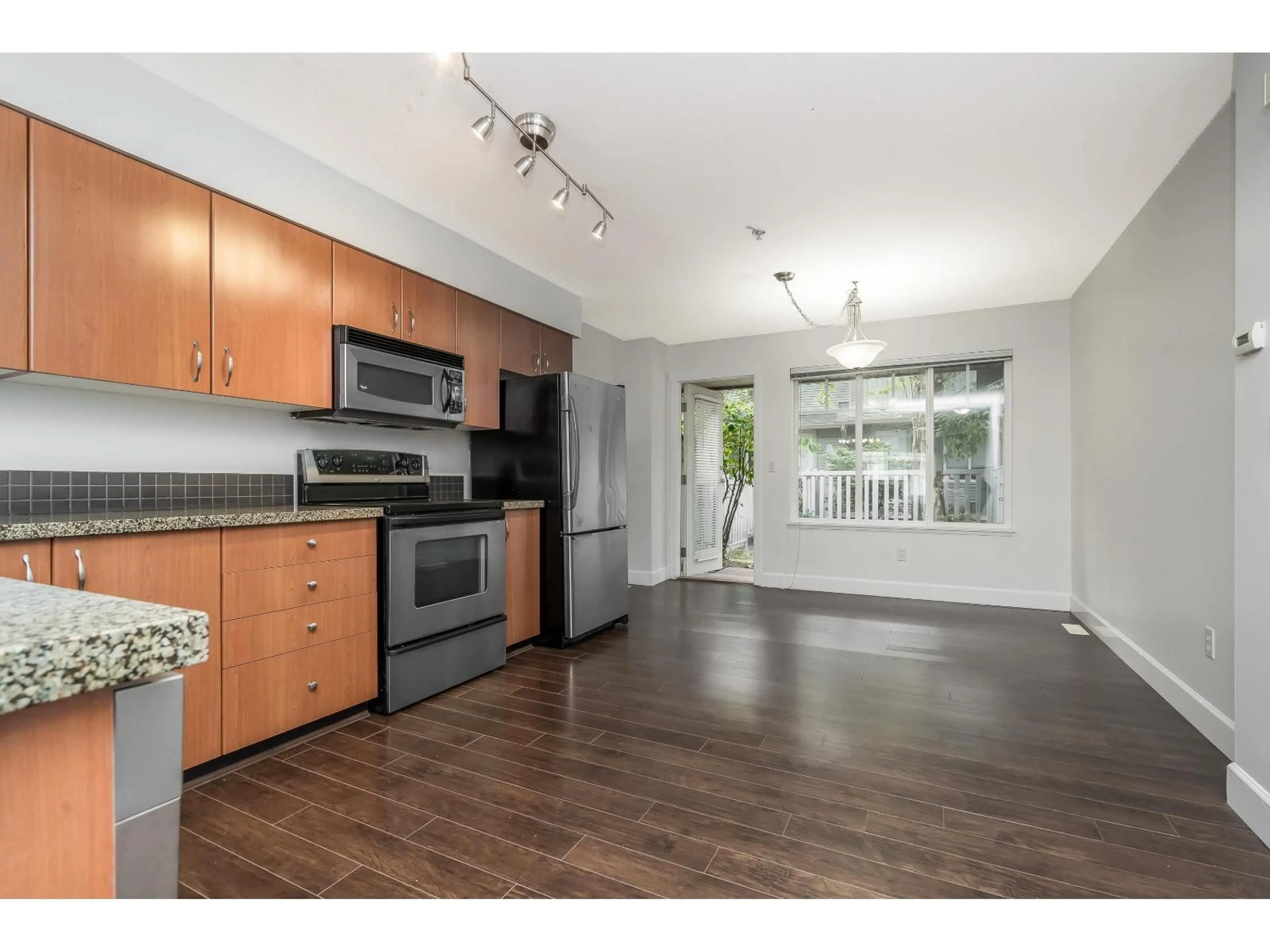 Open concept kitchen, wood/laminate floor for #77 - 12040 68, Surrey British Columbia V3W1P5